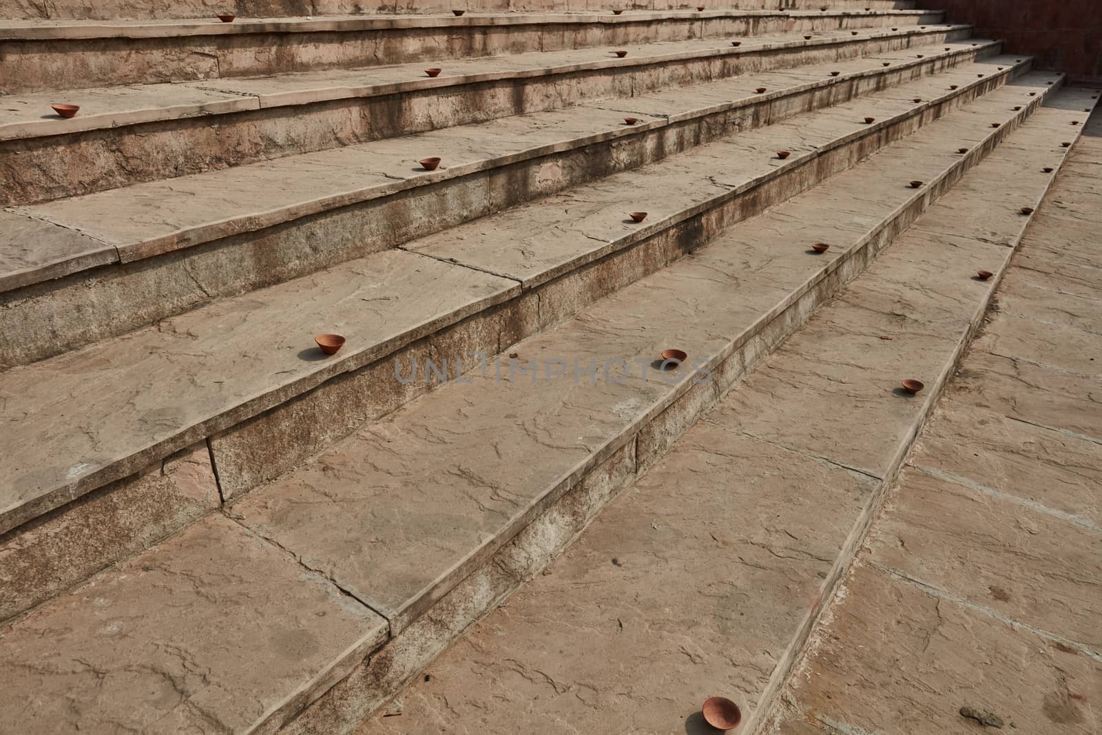 Clay plates arranged on the stairs for diwali celebration in India