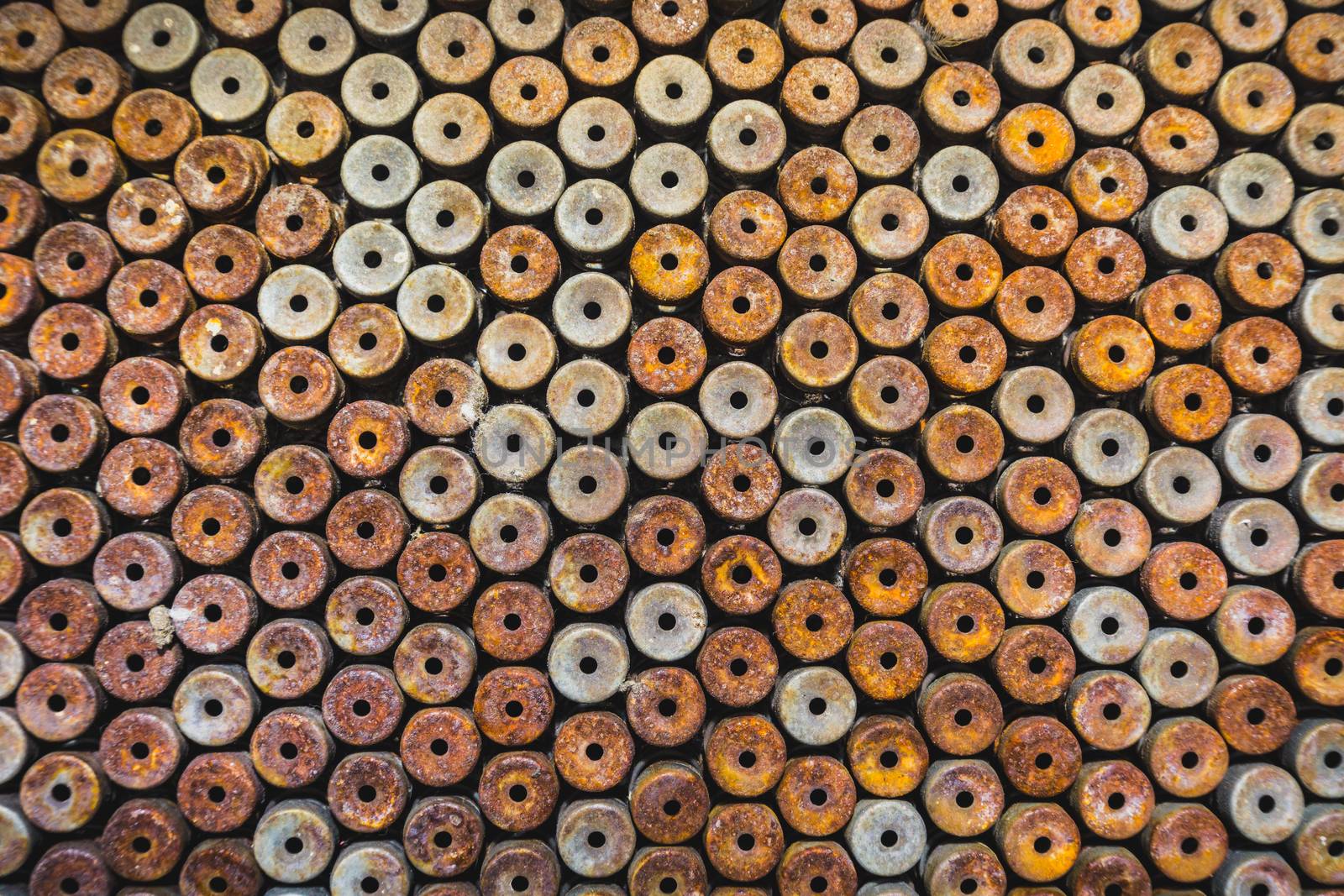 Lot of rust circle aluminum on black background by nopparats