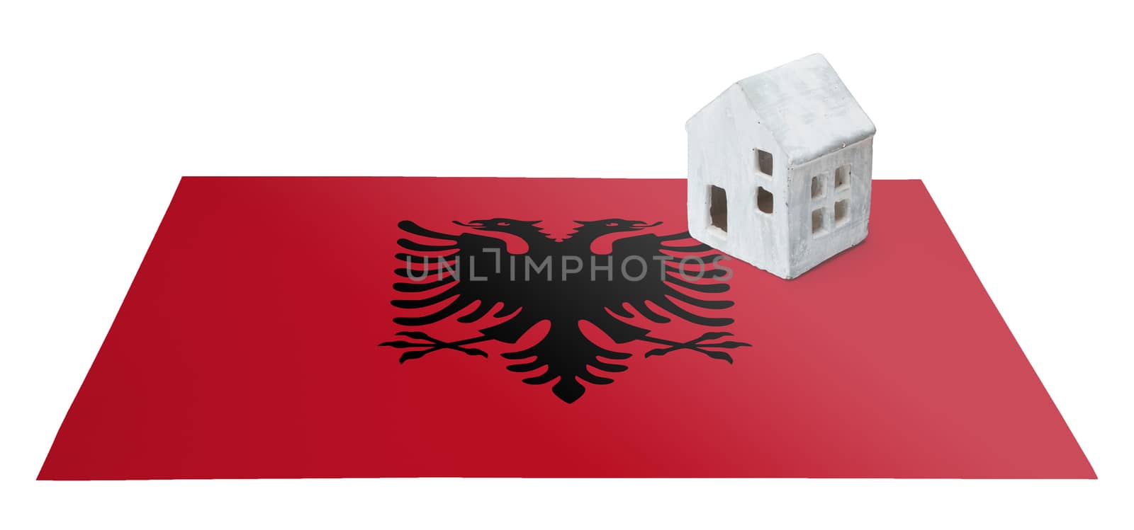 Small house on a flag - Albania by michaklootwijk