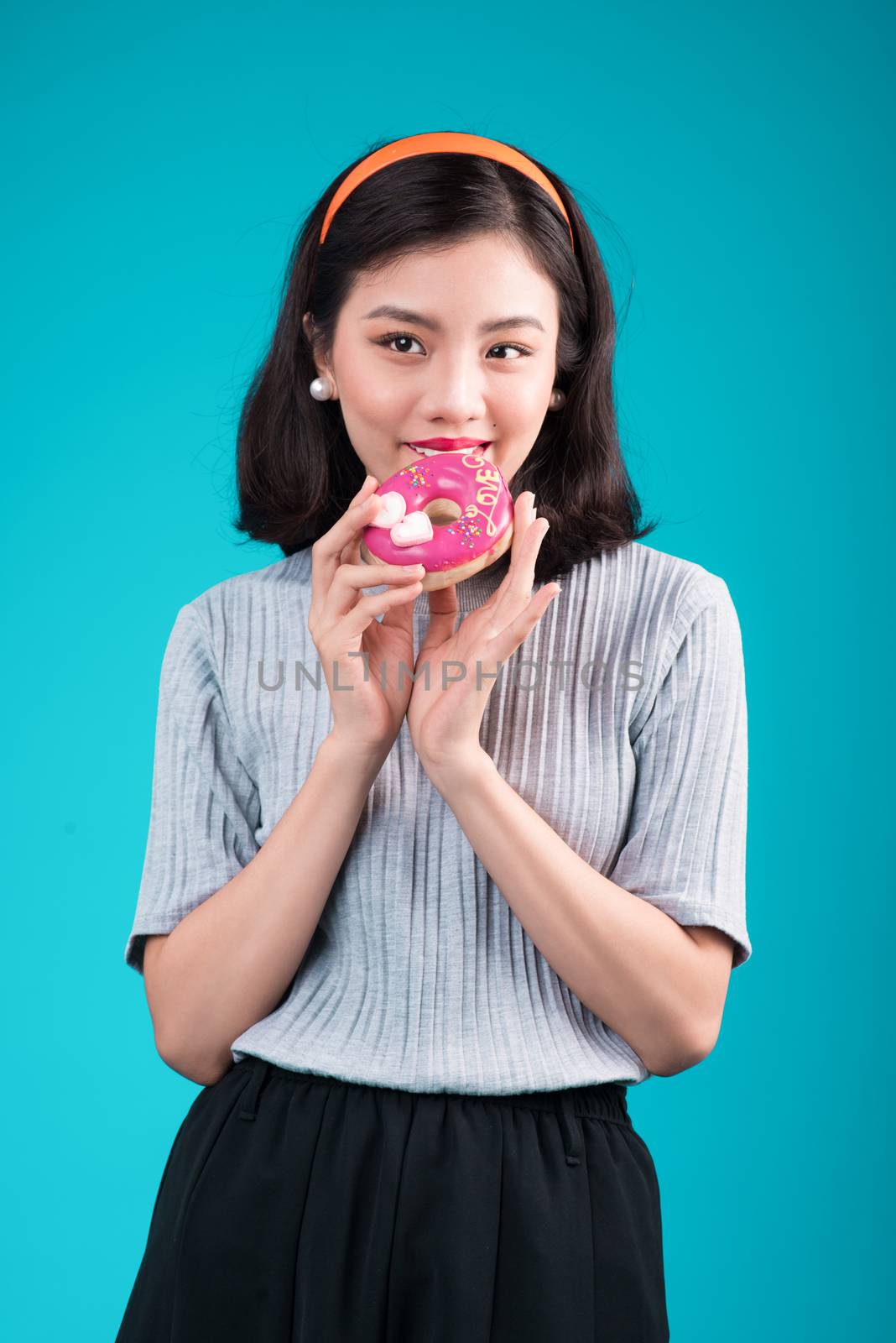 Asian beauty girl holding pink donut. Retro joyful woman with sw by makidotvn