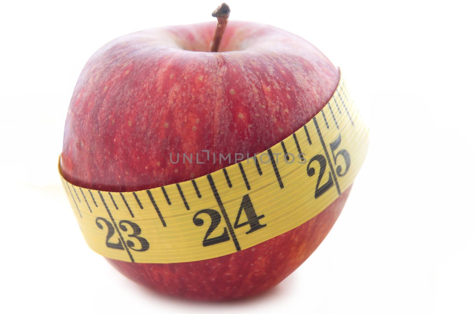 Measuring tape wrapped around an apple