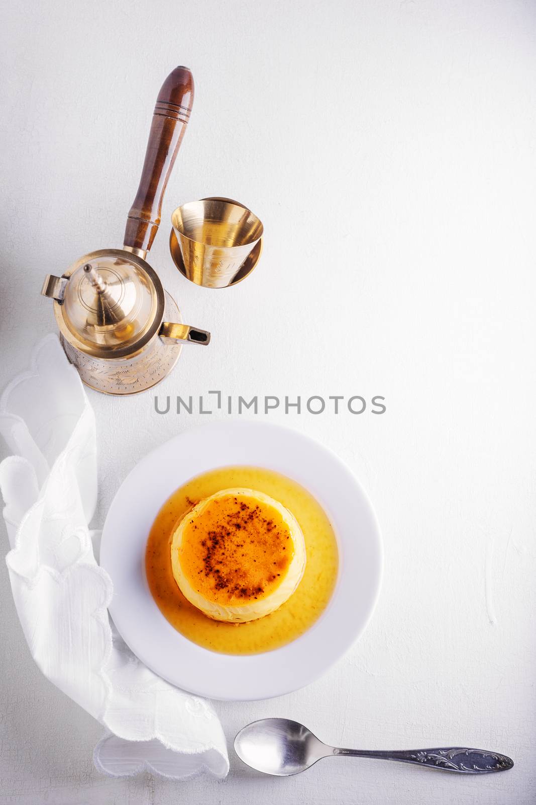 Creme caramel and coffee on the table