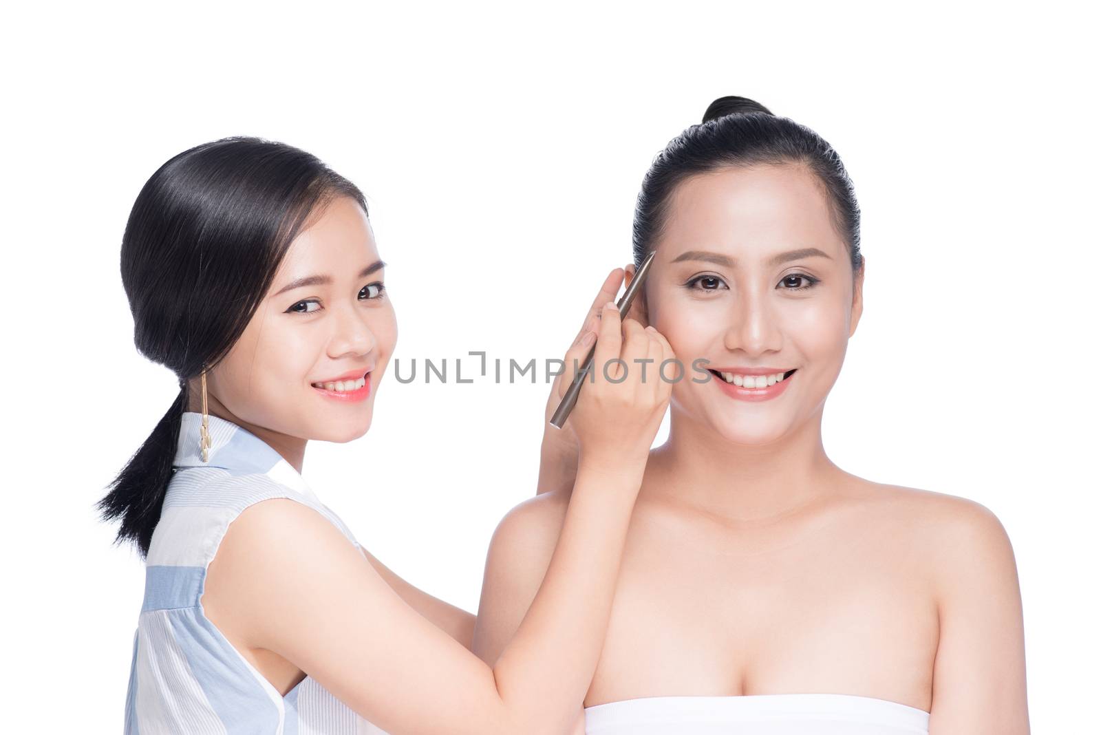 Stylist makes professional eye makeup. Beautiful asian model. by makidotvn