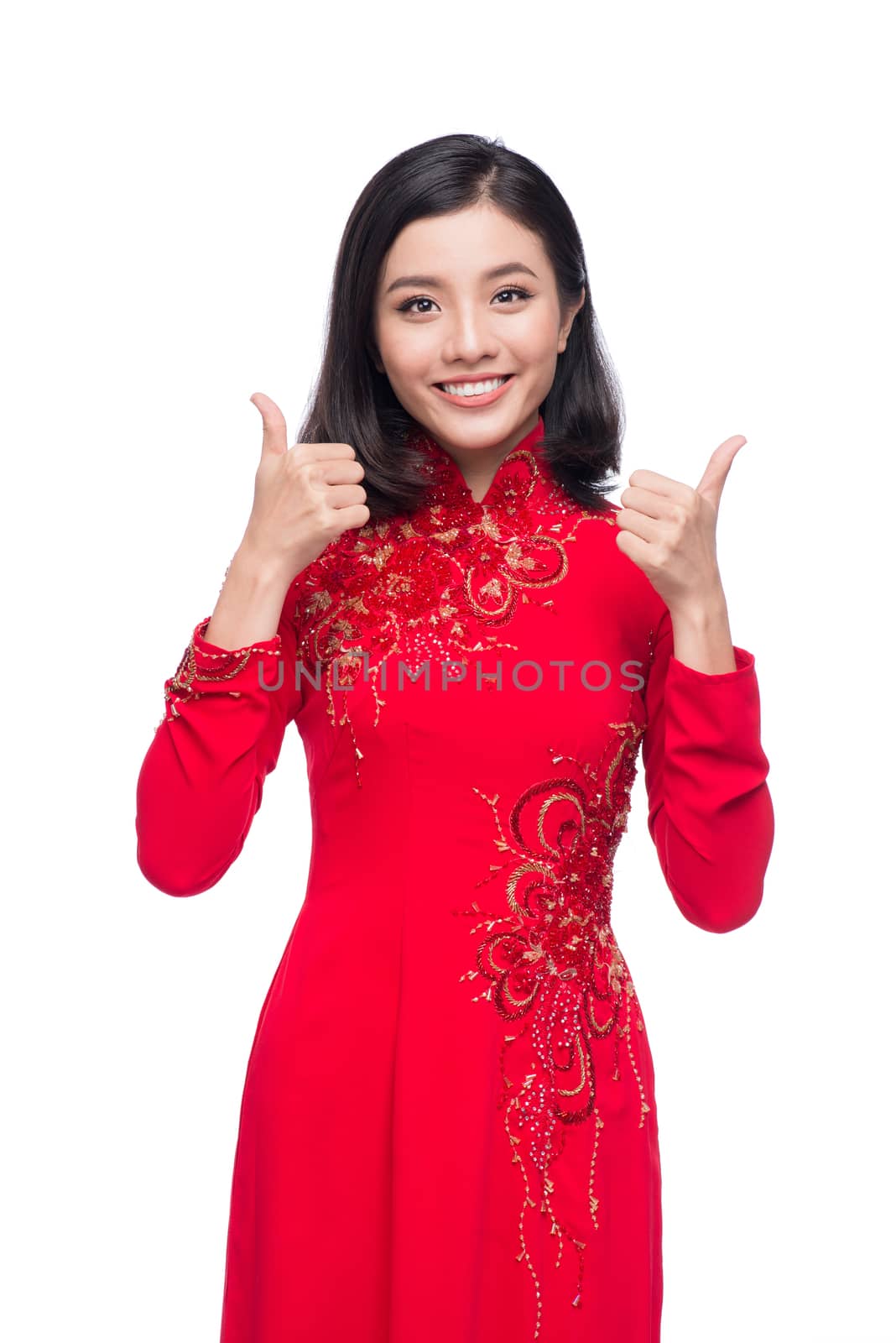 Charming Vietnamese Woman in Red Ao Dai Traditional Dress. gesture good sign.