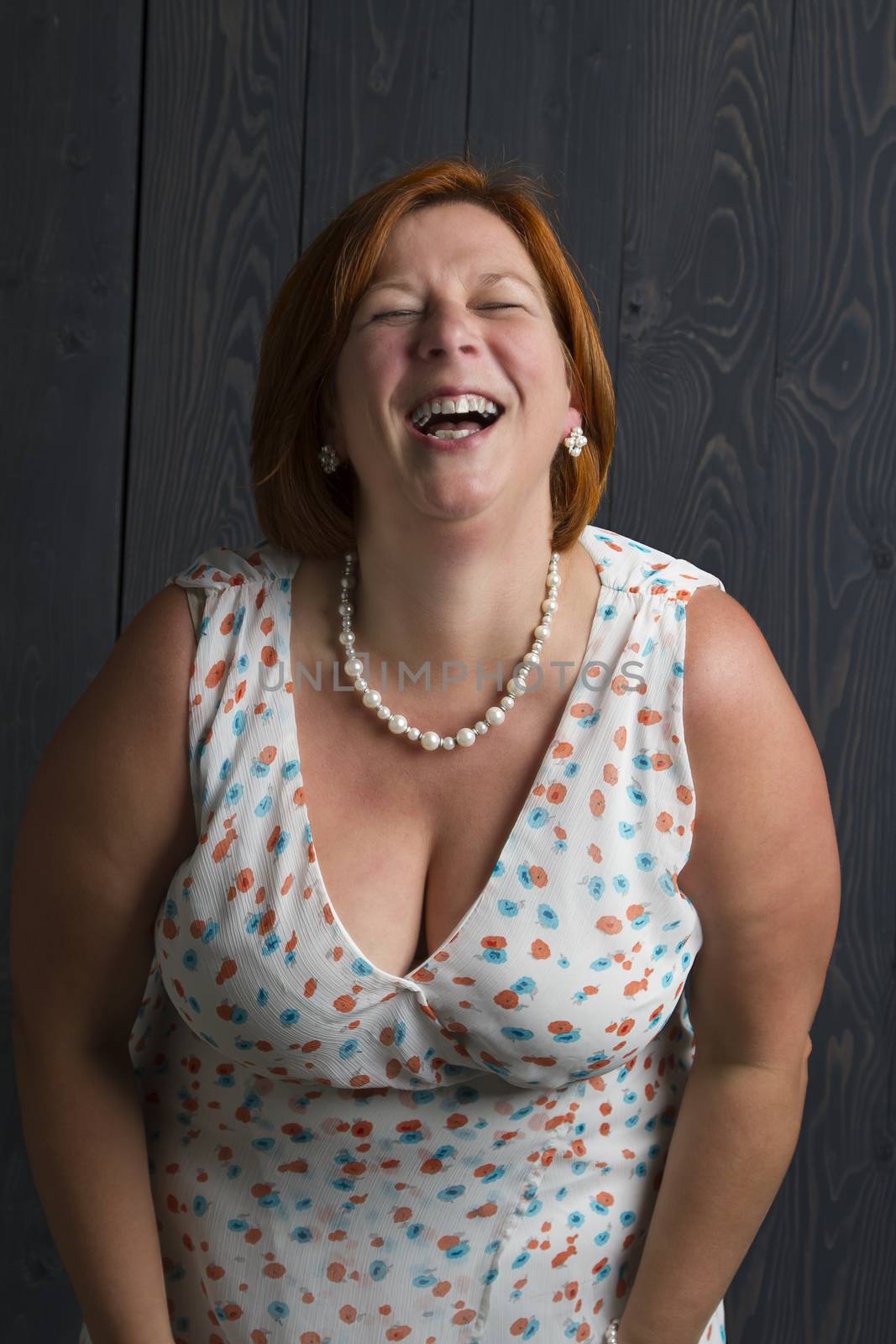 round woman laughing her heart out