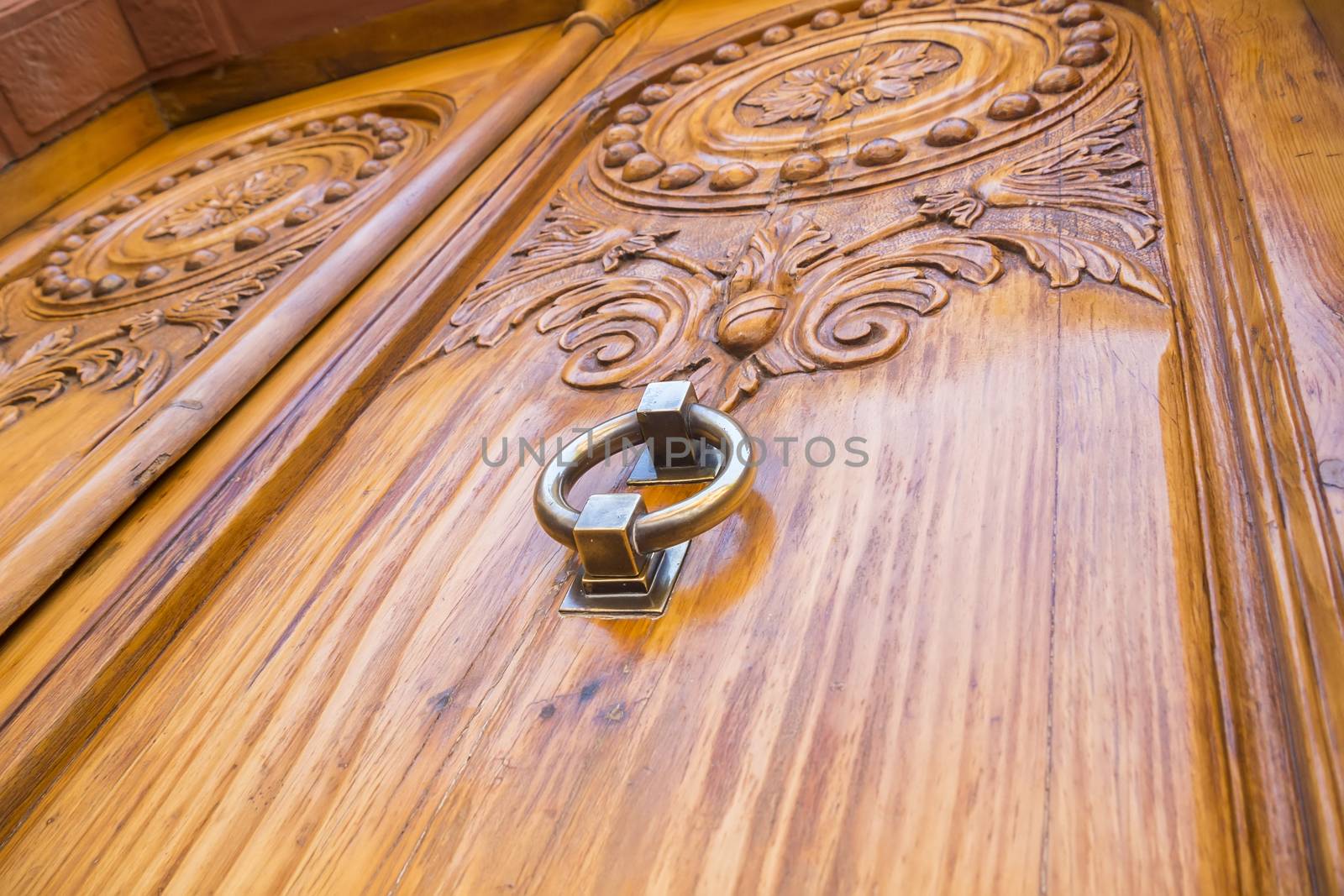 Metal door handle of old wooden door