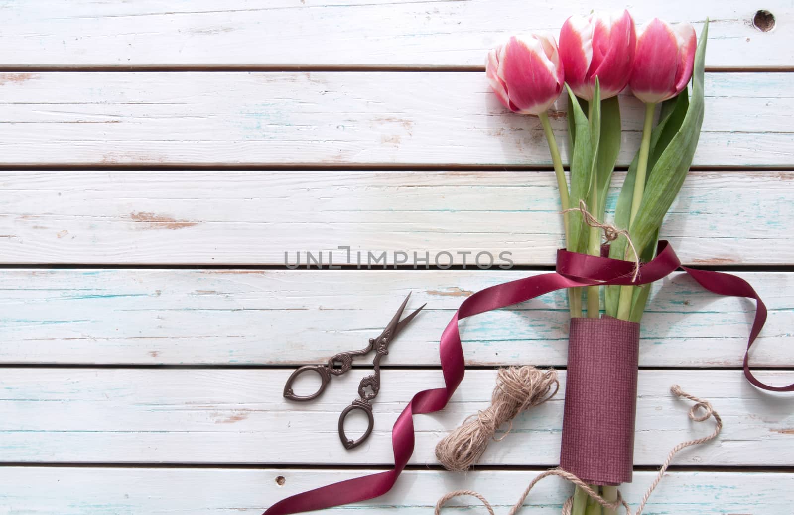 Tulips on a wooden background 