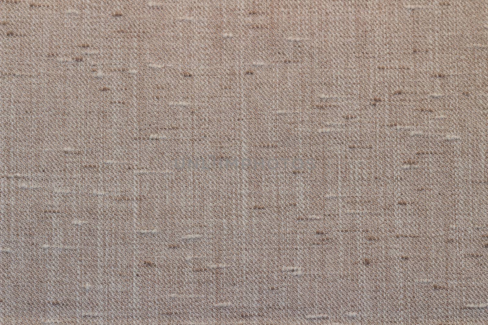 Rustic canvas fabric texture in sand color.