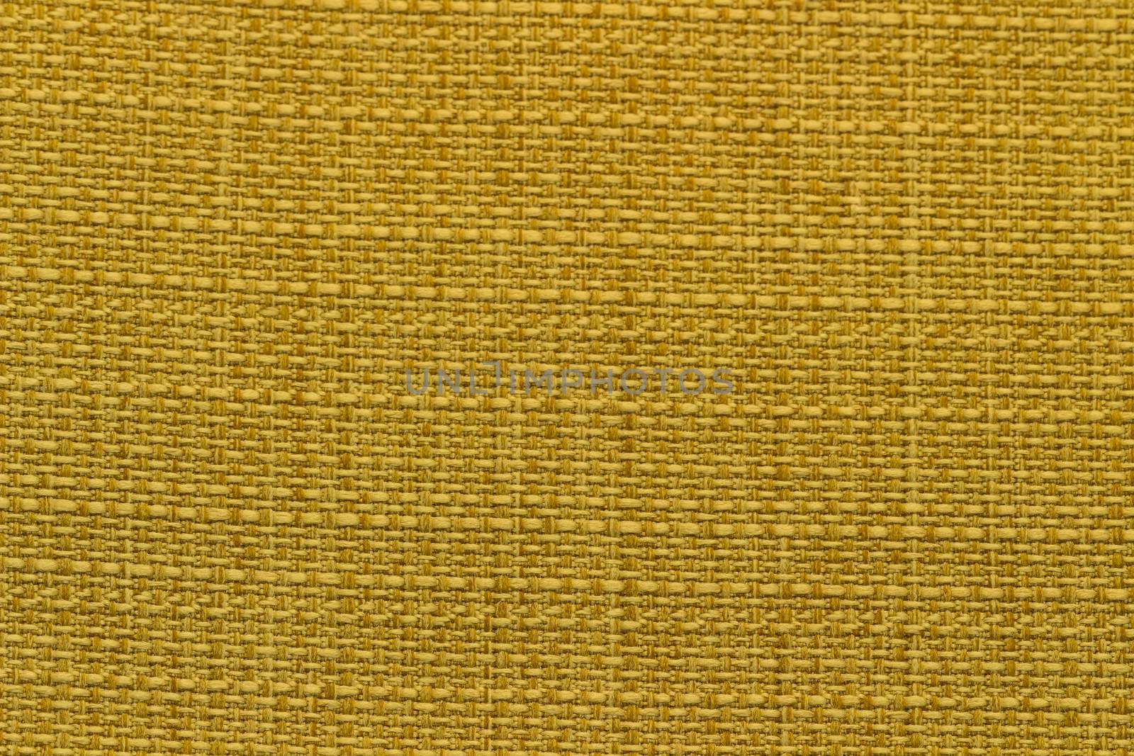 Rustic canvas fabric texture in yellow color and tweed pattern.