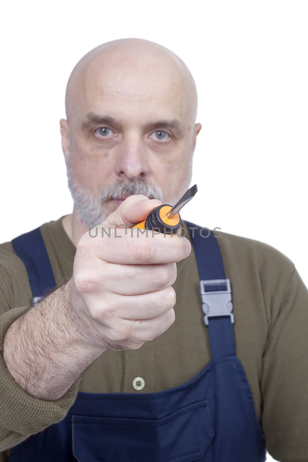 Bearded man in overalls with a screwdriver