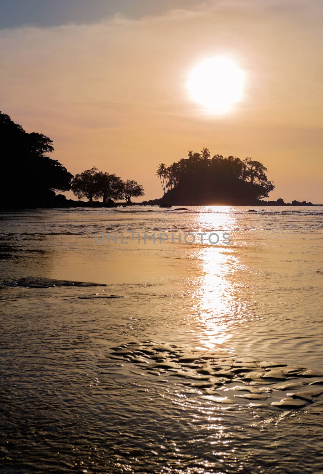 Beautiful colorful sunset near the smal eaxotic island with palm by rainfallsup