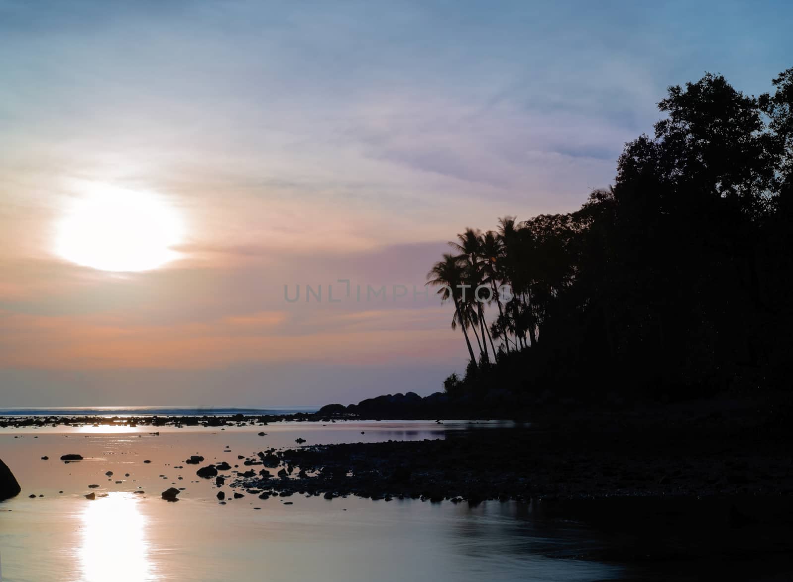 Beautiful colorful sunset near the smal eaxotic island with palm by rainfallsup