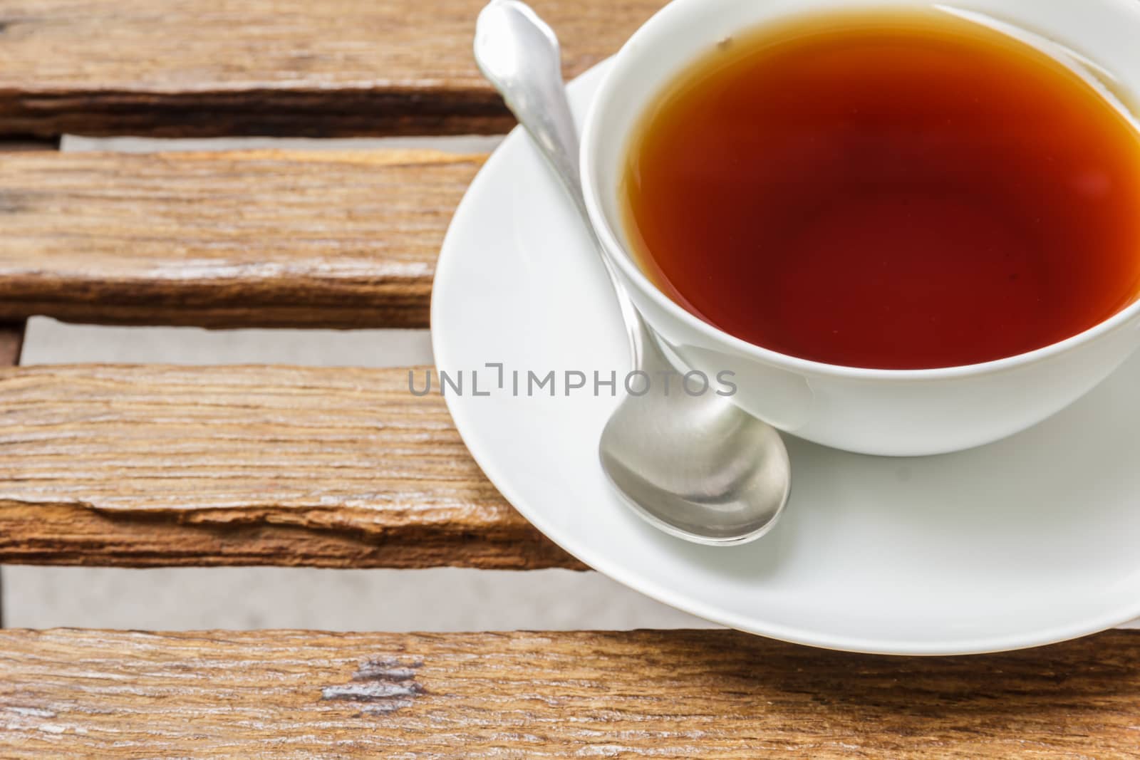 Cup of black tea by photosam