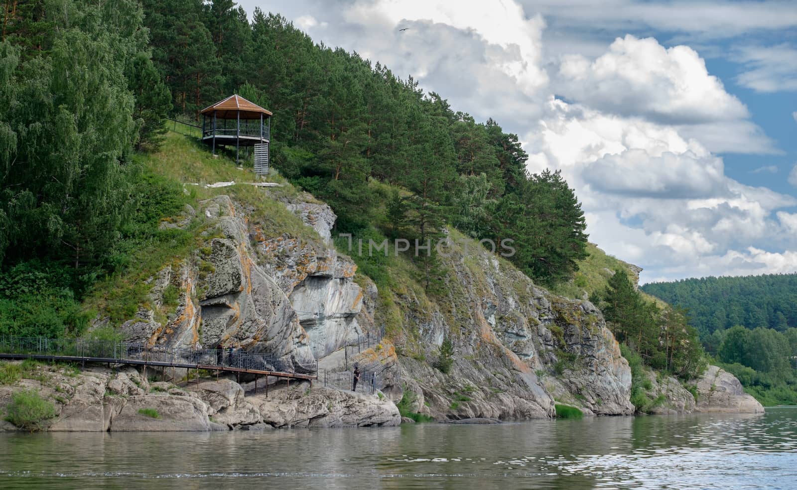 Nice wooden pavillion on the river bank in he forest. Russia. Si by rainfallsup