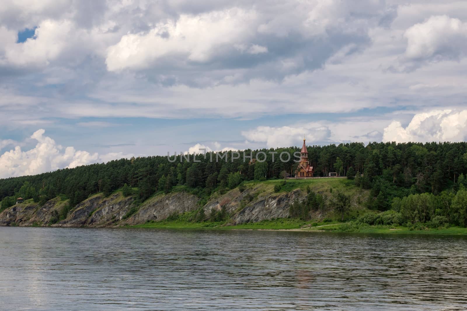 Beautifull wooden christian orthodox church on the bank of the river. Sts Kirill and Methodius chapel at Tomskaya pisanitsa. Siberia. Taiga.