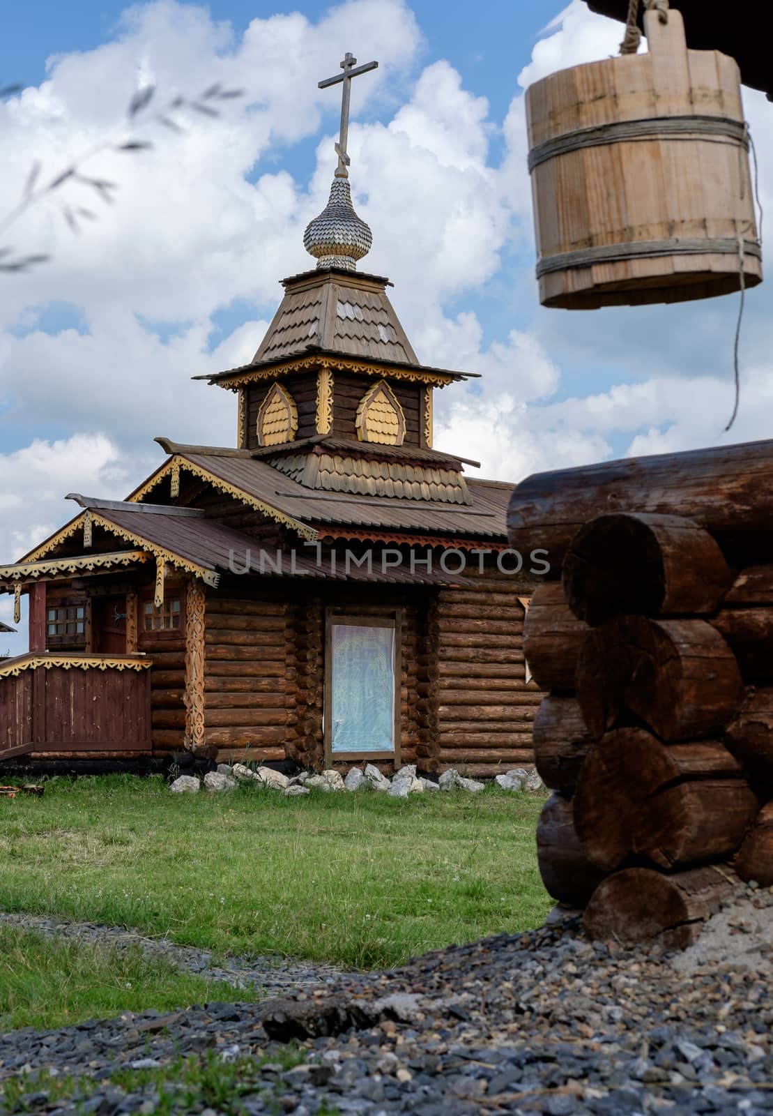 Wooden Church in Semiluzhenski kazak ostrog and wooden water wel by rainfallsup