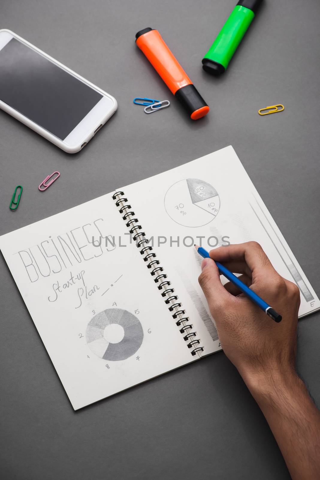 Business concept. Businessman writing idea sketch