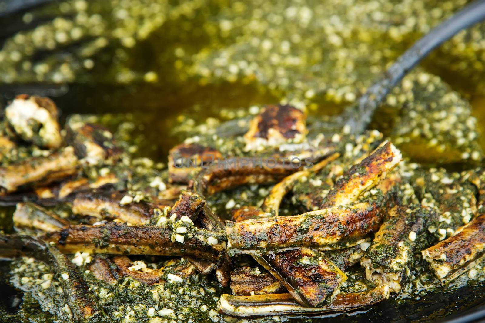 Cooked eel fish for sale at French provincial market by pixinoo