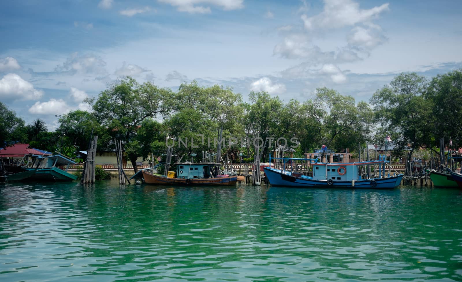 Boats in Jetty. Mersing Malaysia by rainfallsup
