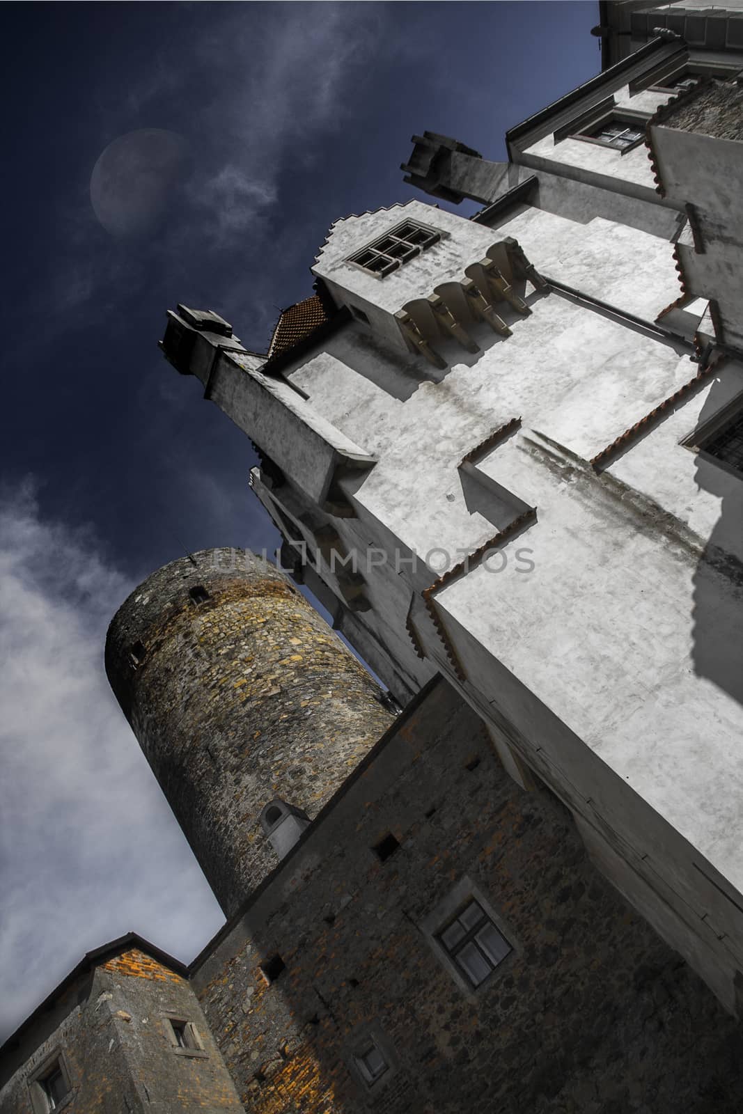 Heidenrehstein castle in the night with clouds and moon by rainfallsup