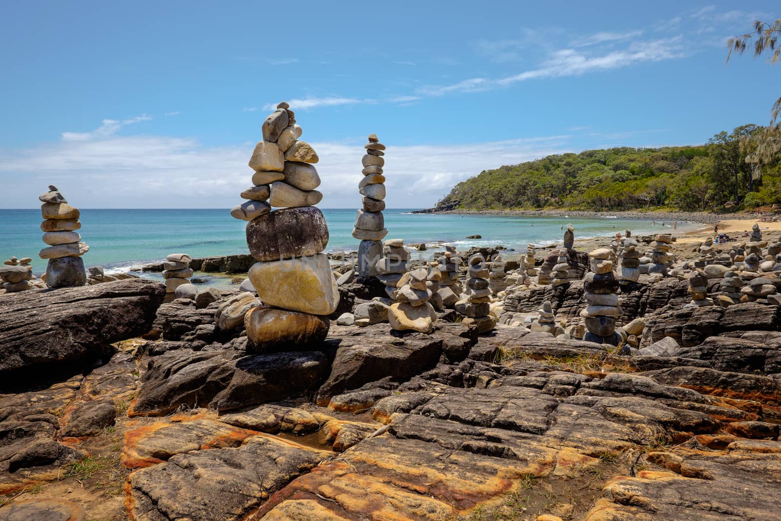 Stacked stones at Tea Tree Bay, Noosa parc, Australia by rainfallsup