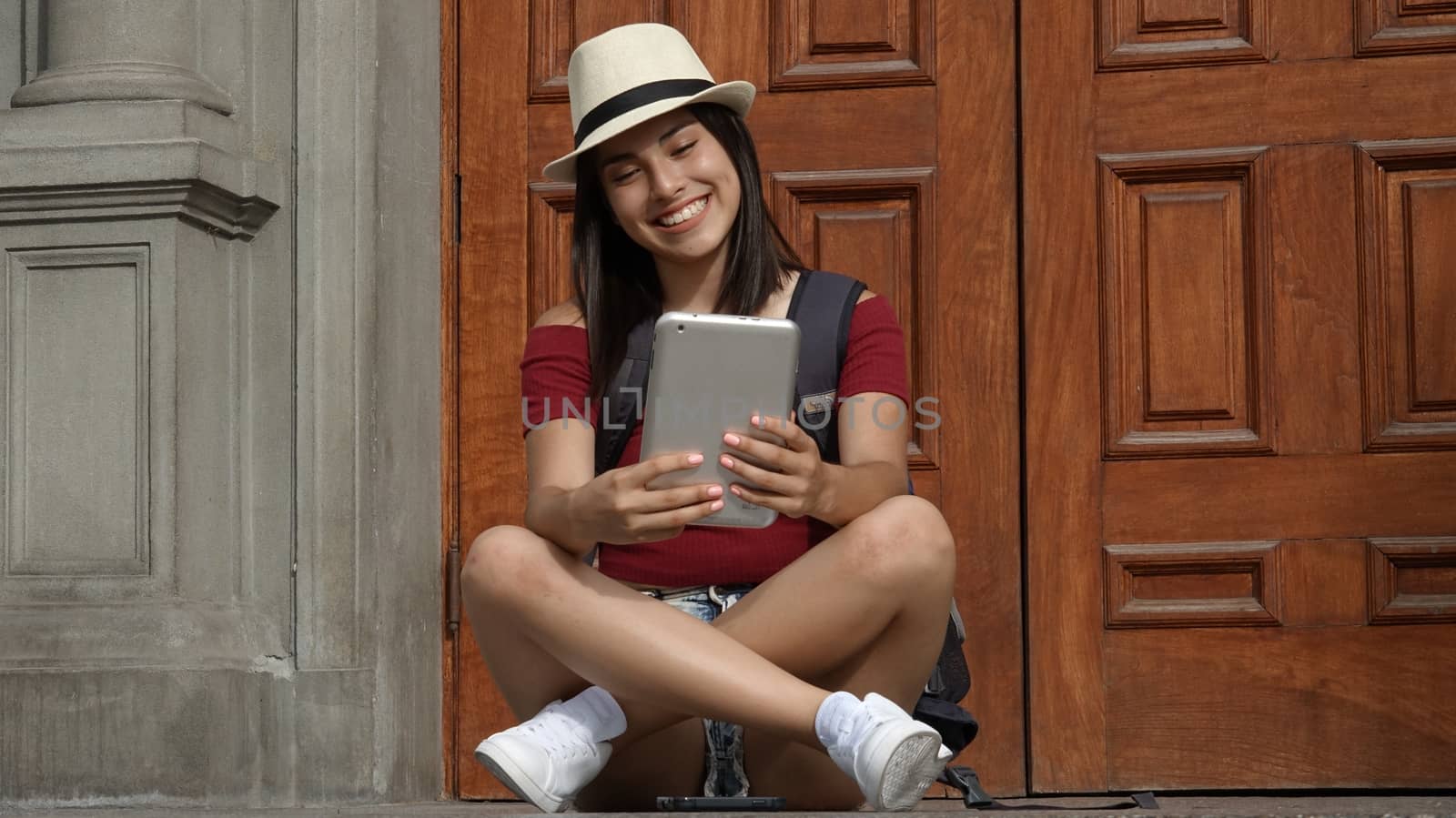 Teen Girl Using Tablet by dtiberio