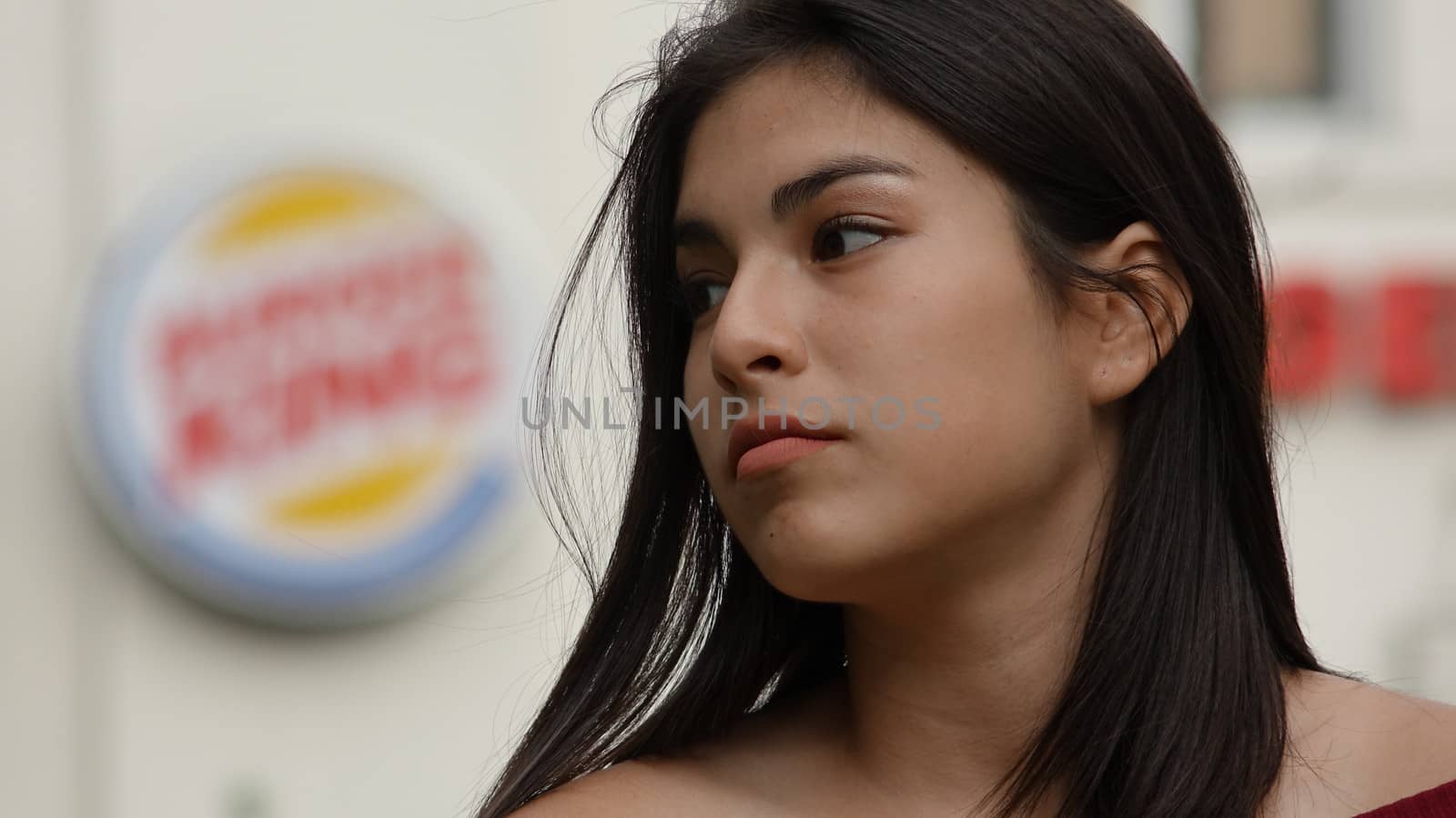 Female Teen At Fast Food Restaurant by dtiberio