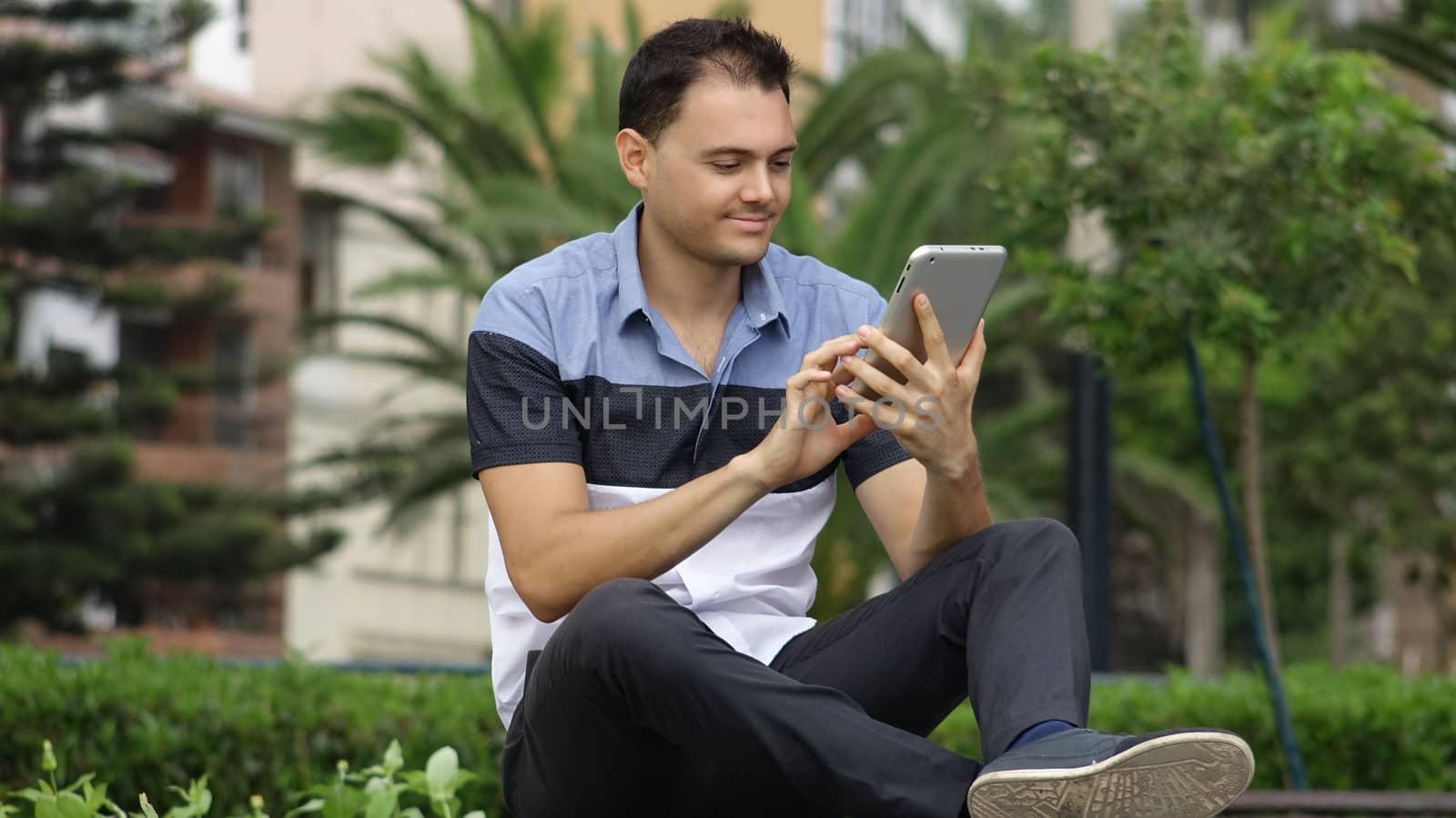 Happy Man Using Tablet