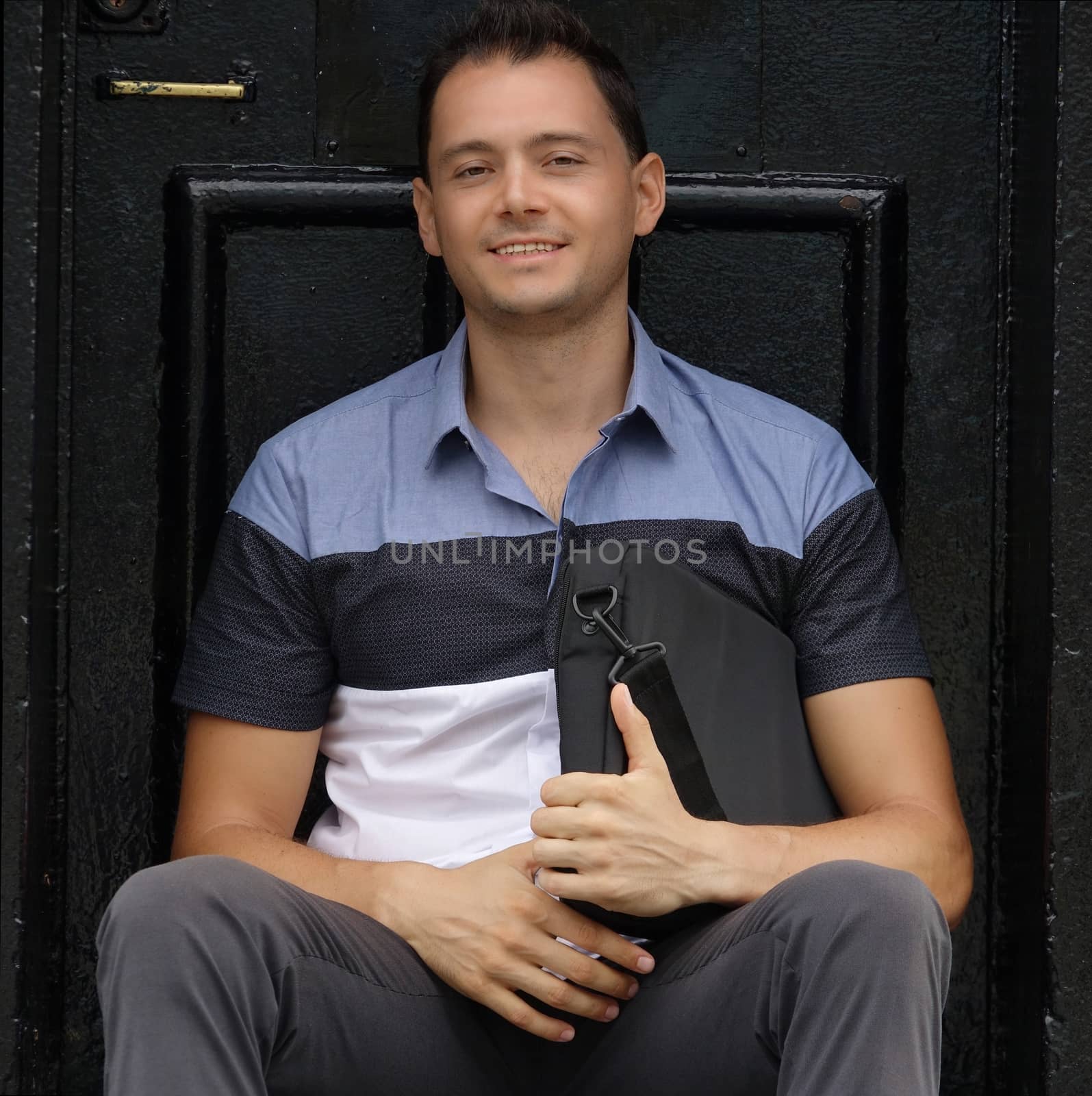 Happy Male Student With Satchel