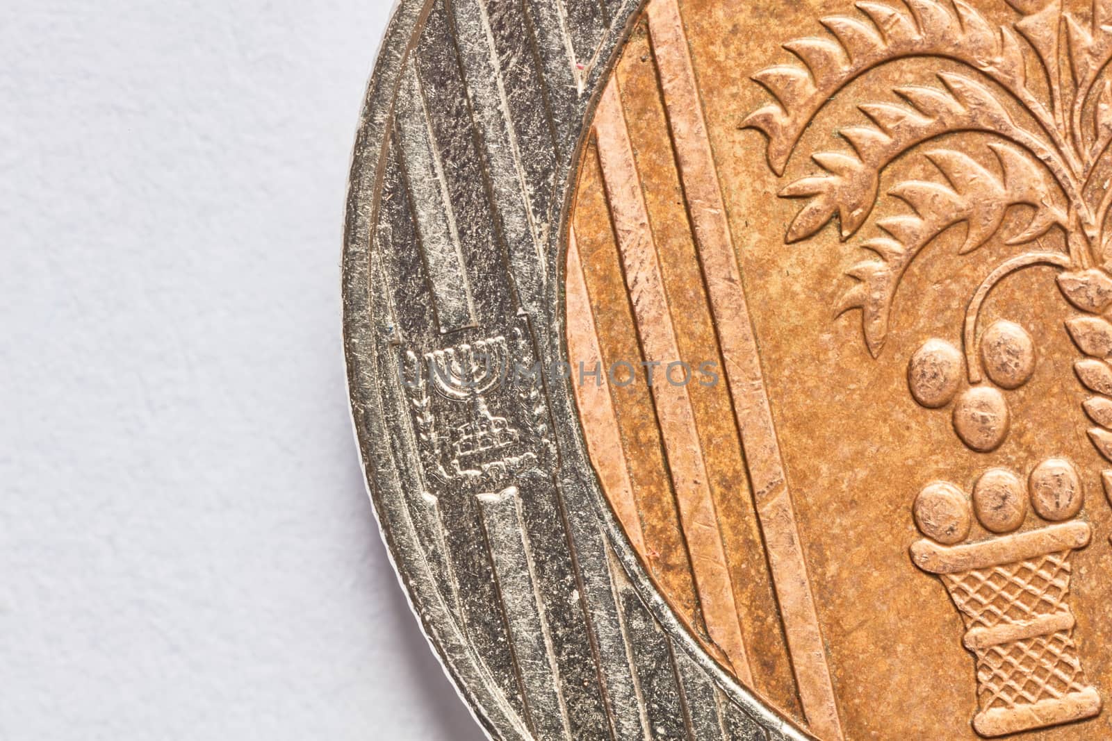 Ten shekel coin macro isolated on white surface