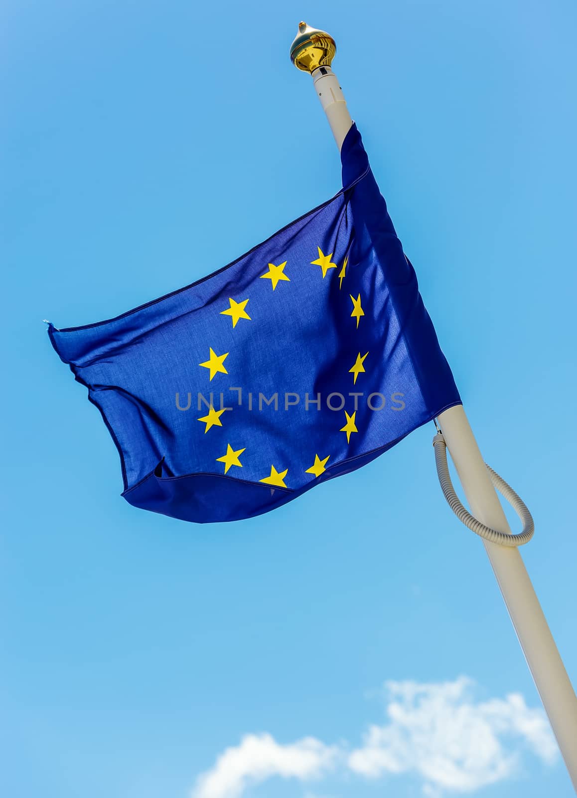 flag of the European Union with clouds underneath symbolizing darkening by pixinoo