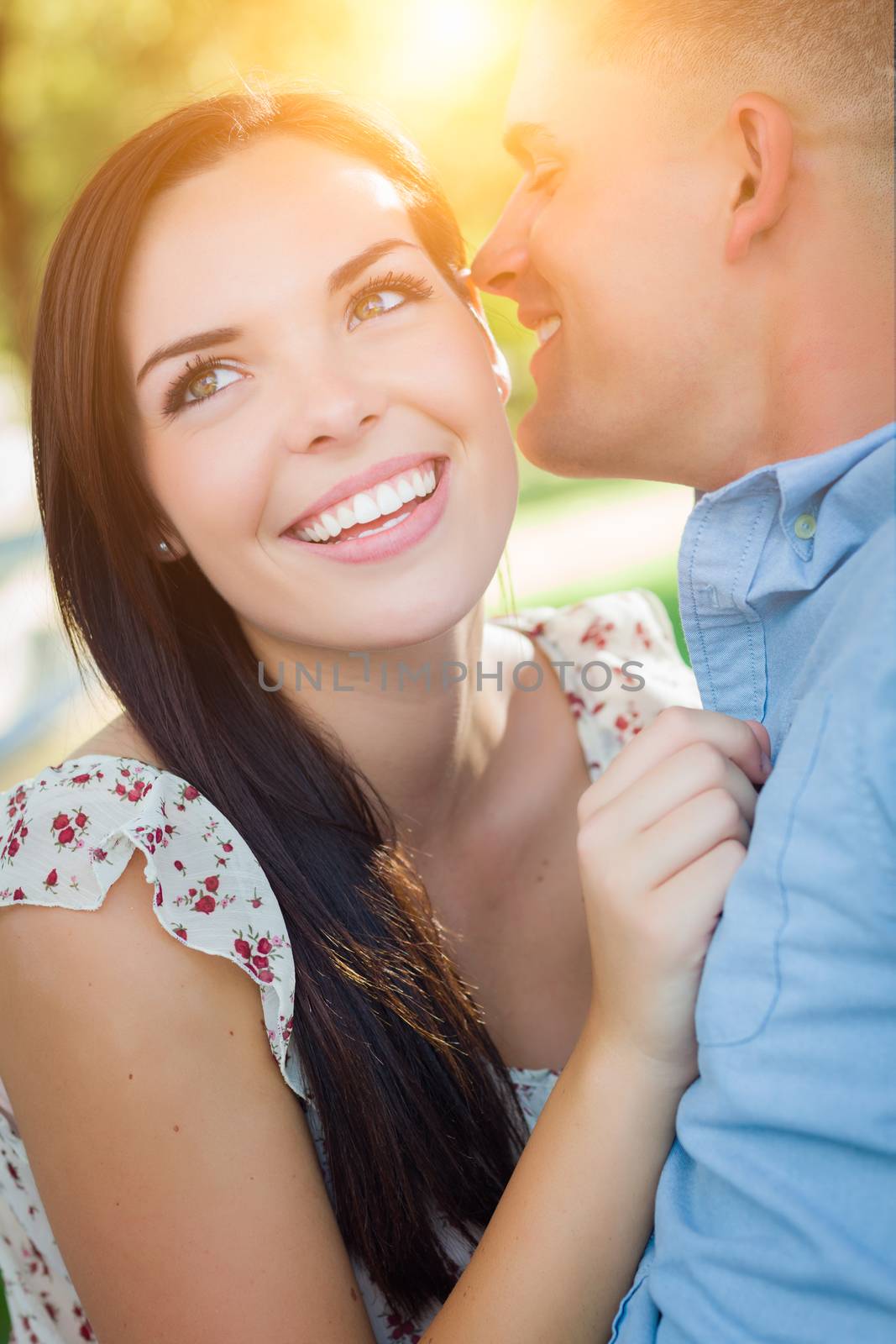 Happy Mixed Race Romantic Couple Portrait in the Park. by Feverpitched
