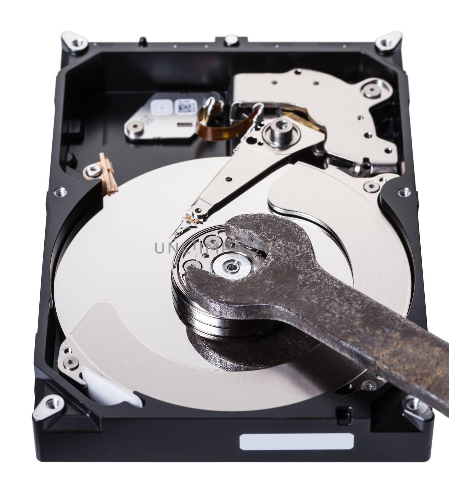 Disassembled computer hard disk and tool close-up
