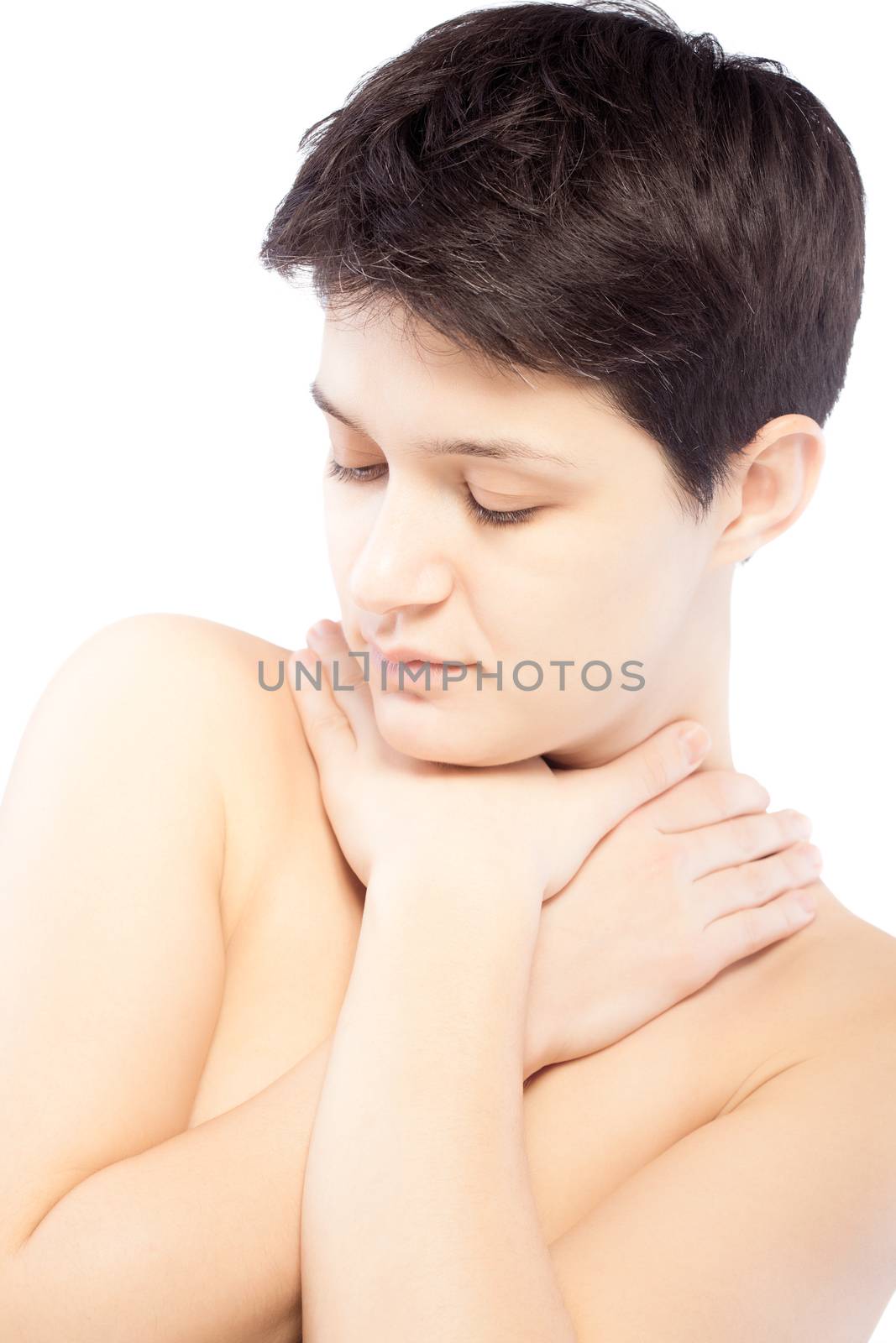 girl with a short hair touching her neck and looking down