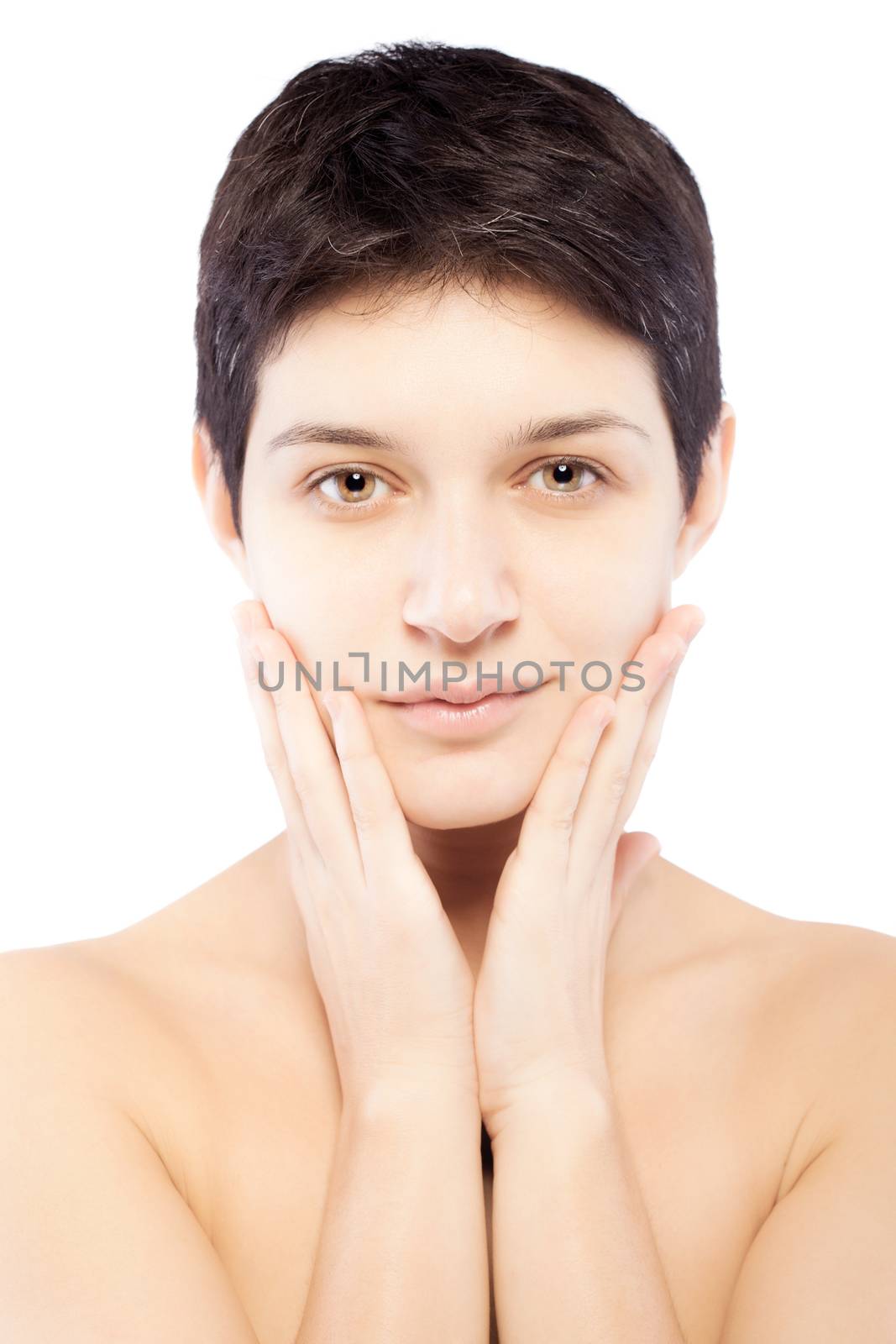 girl with a short hair touching her face
