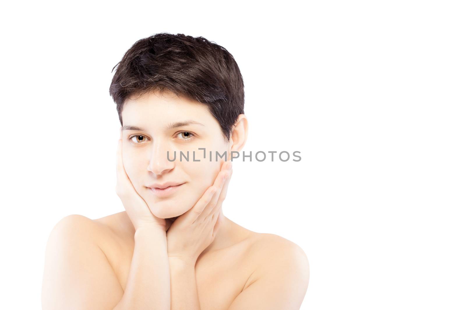 girl with a short hair touching her face and looking at camera