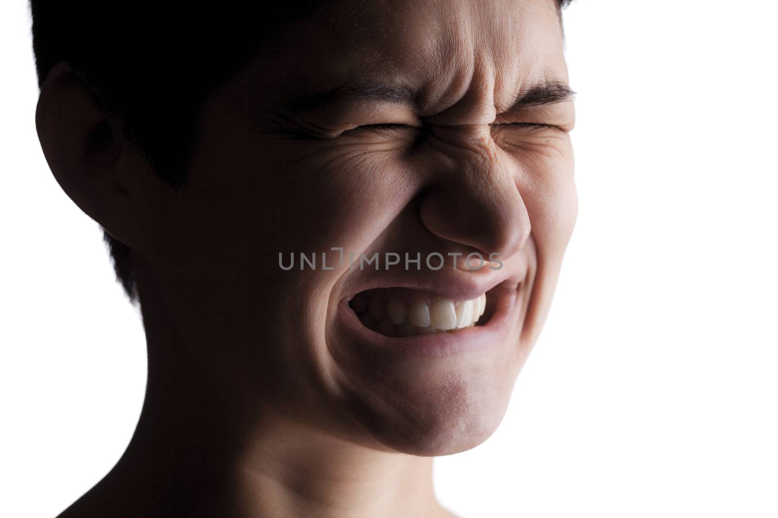 portrait of a girl with a short hair looking at camera, in pain expression