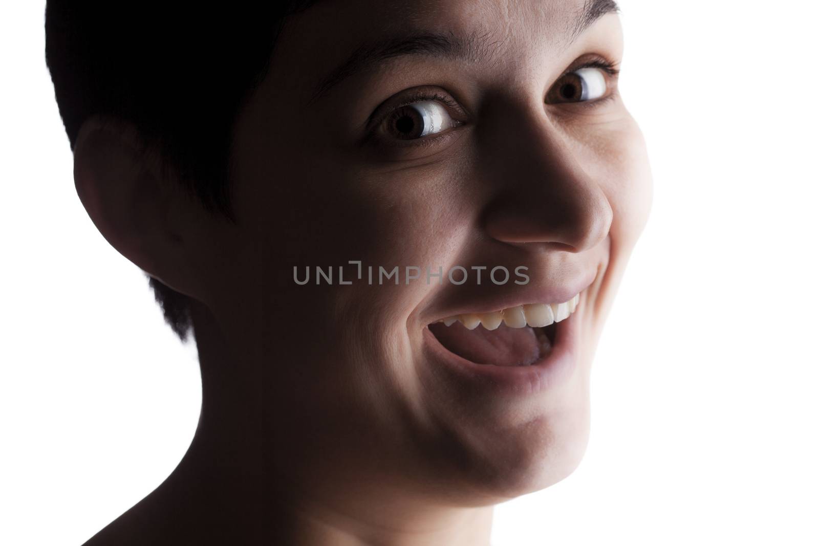 portrait of a girl with a short hair looking at camera, making happy expression