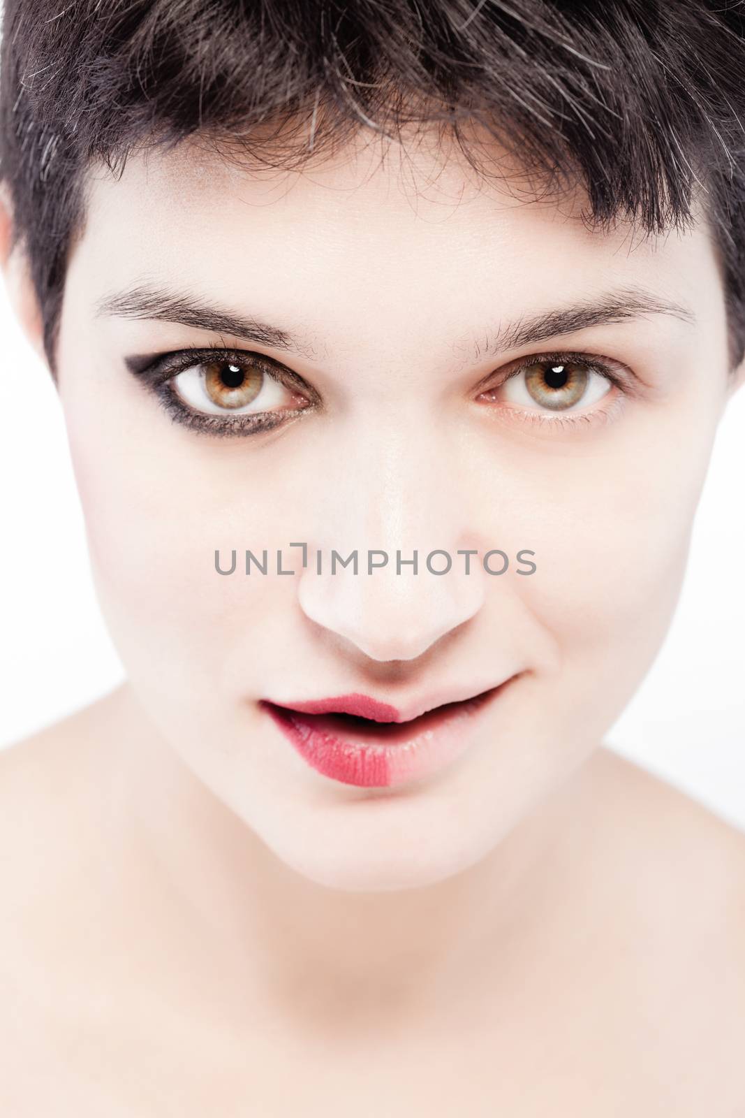 girl with a short hair, having half her face with make up, happy expression