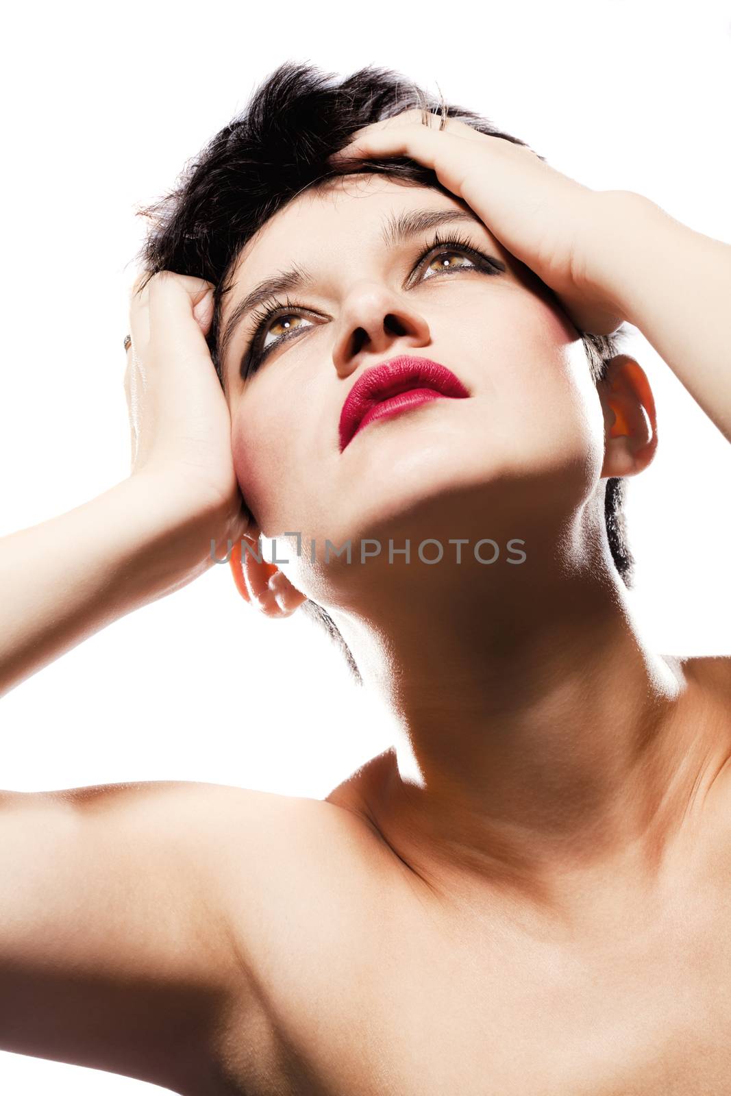 studio portrait of a girl with short hair, looking up