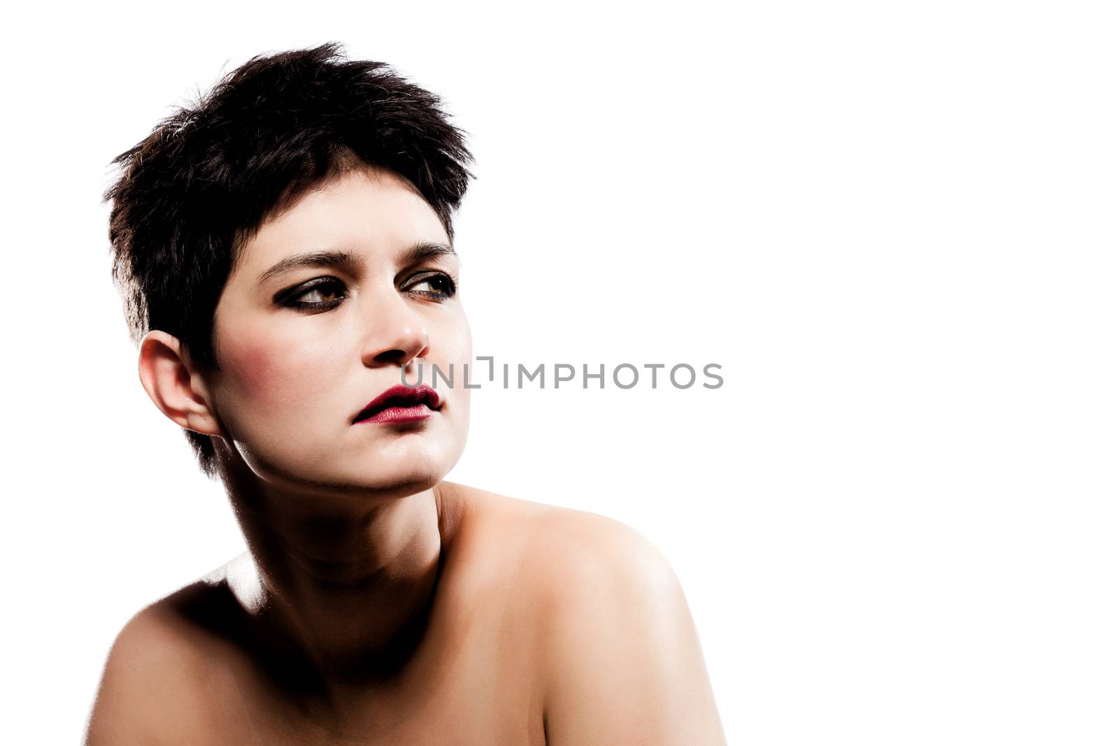 studio portrait of a girl with short hair, looking on her left