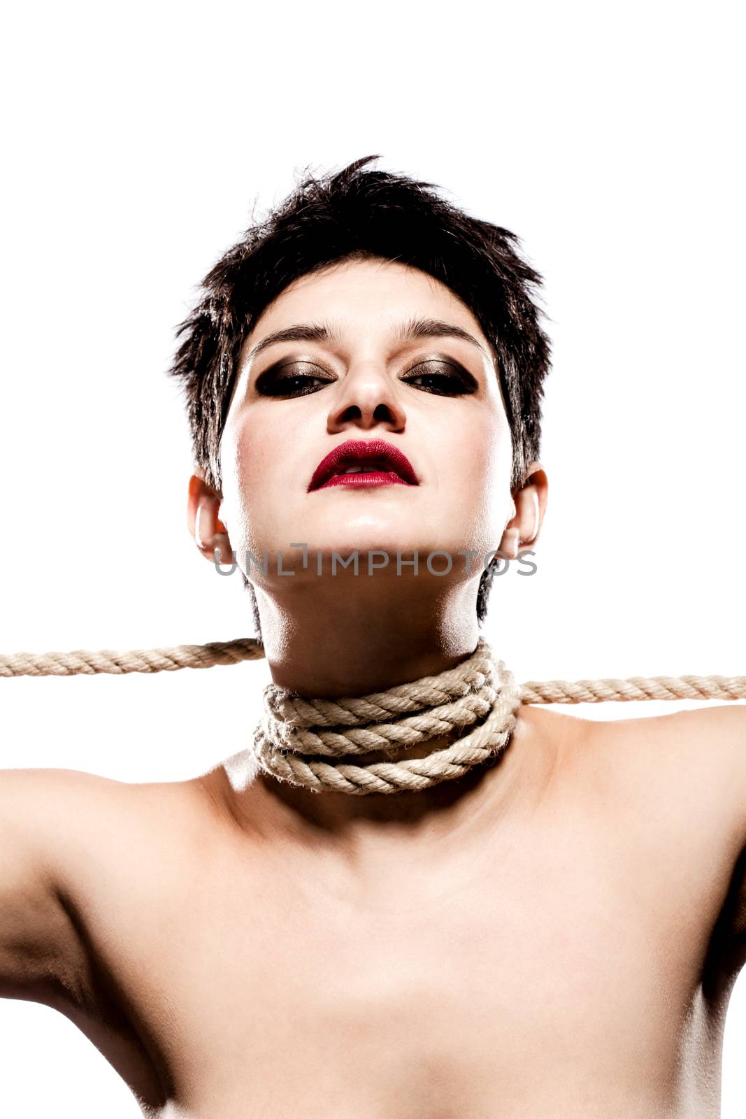 girl with short hair, having rope around her neck, looking at camera from above