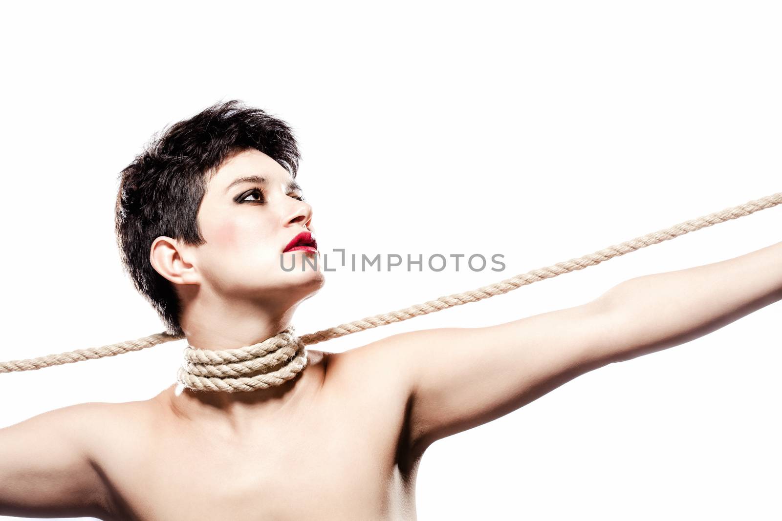 girl with short hair, having rope around her neck, looking on her left