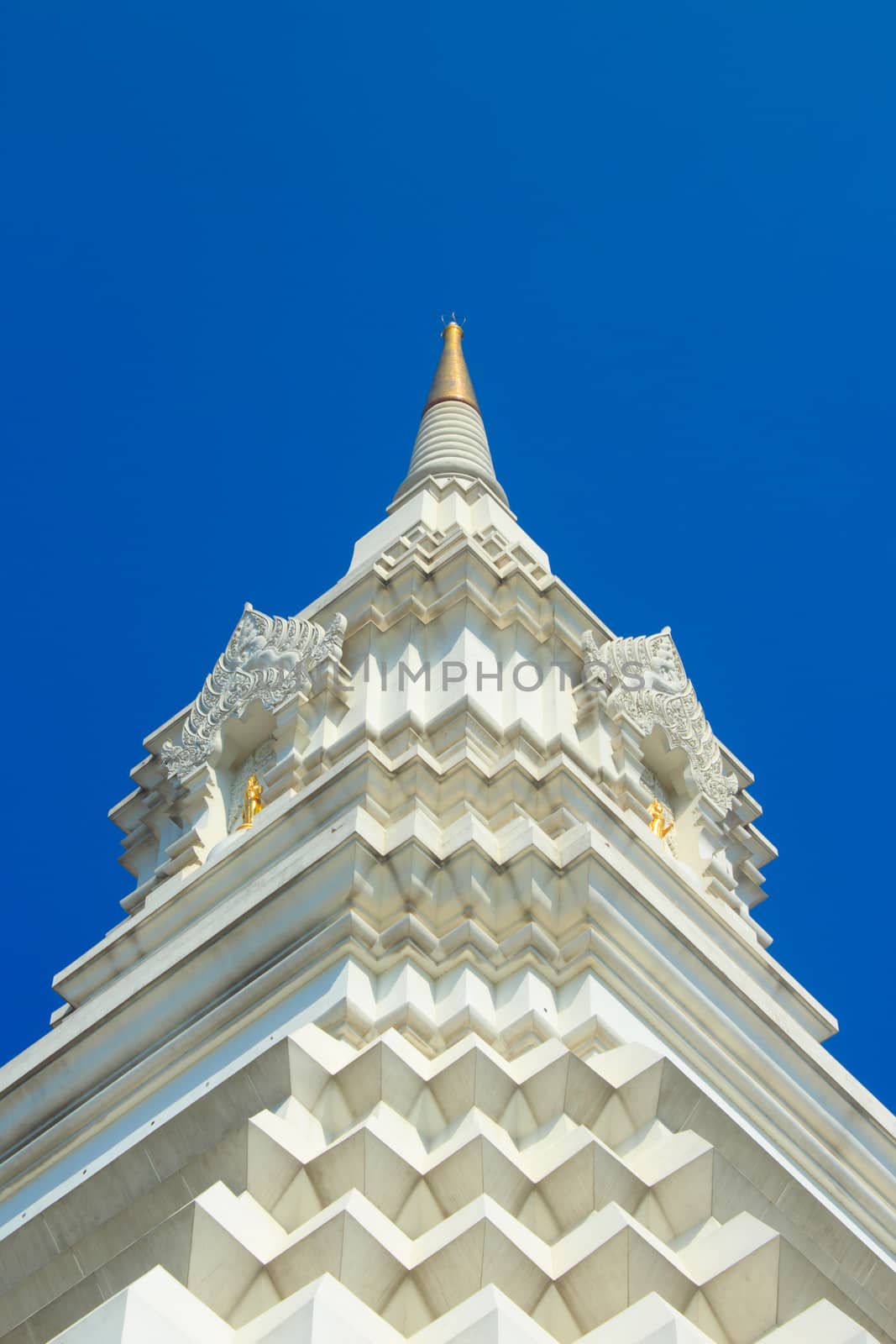 White pagoda on blue sky by mesamong