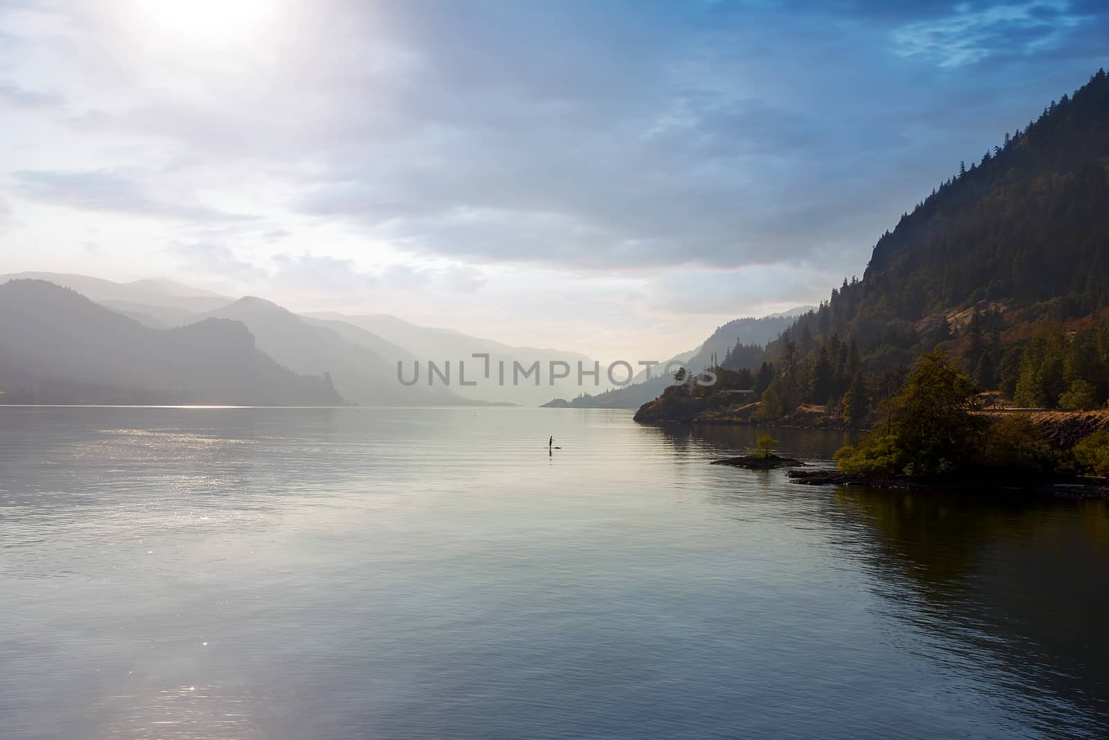 Paddle Boarding on the Columbia River Gorge in the hazy afternoon