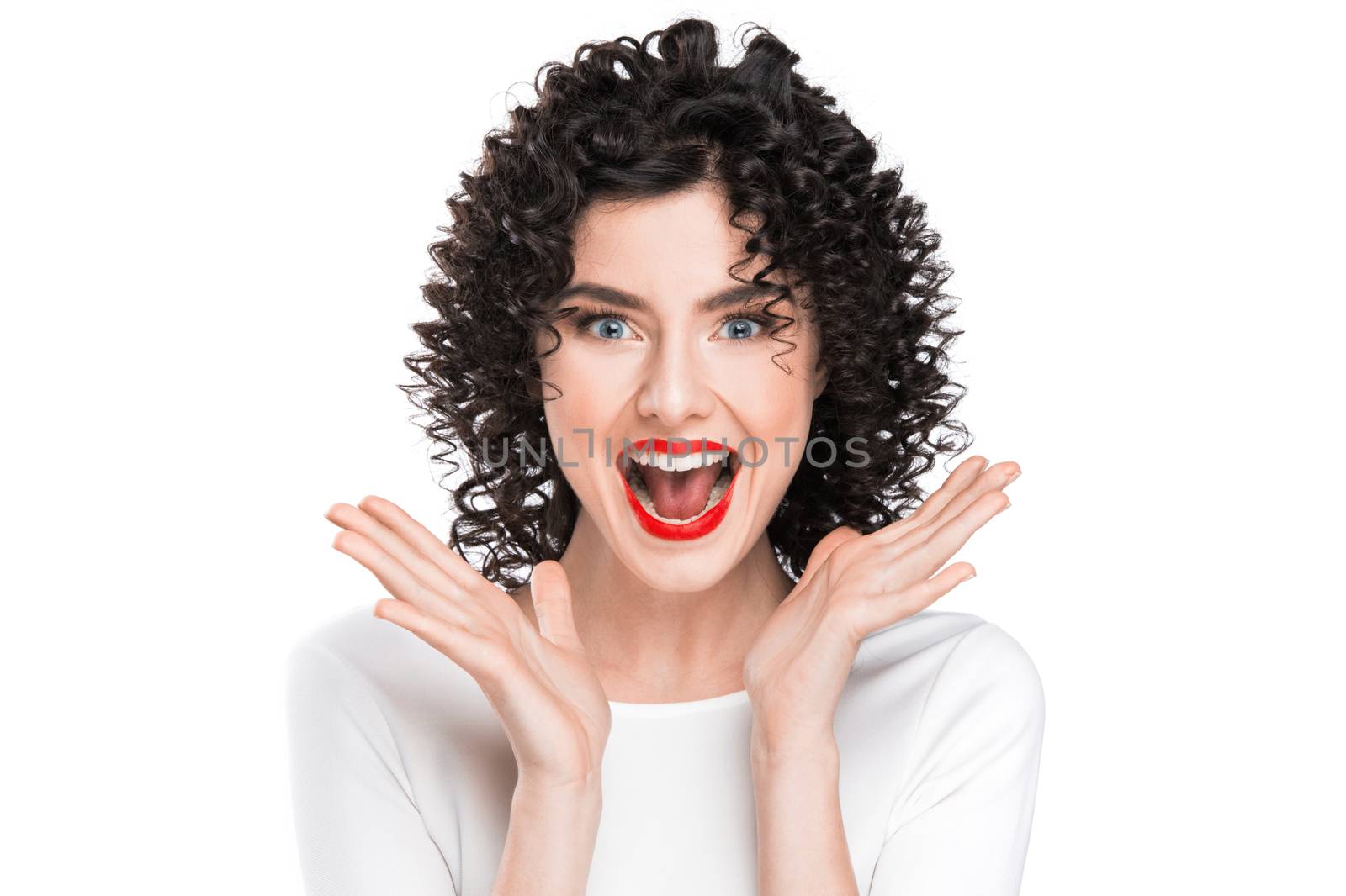 Surprised excited beautiful woman screaming amazed in joy, isolated on white background