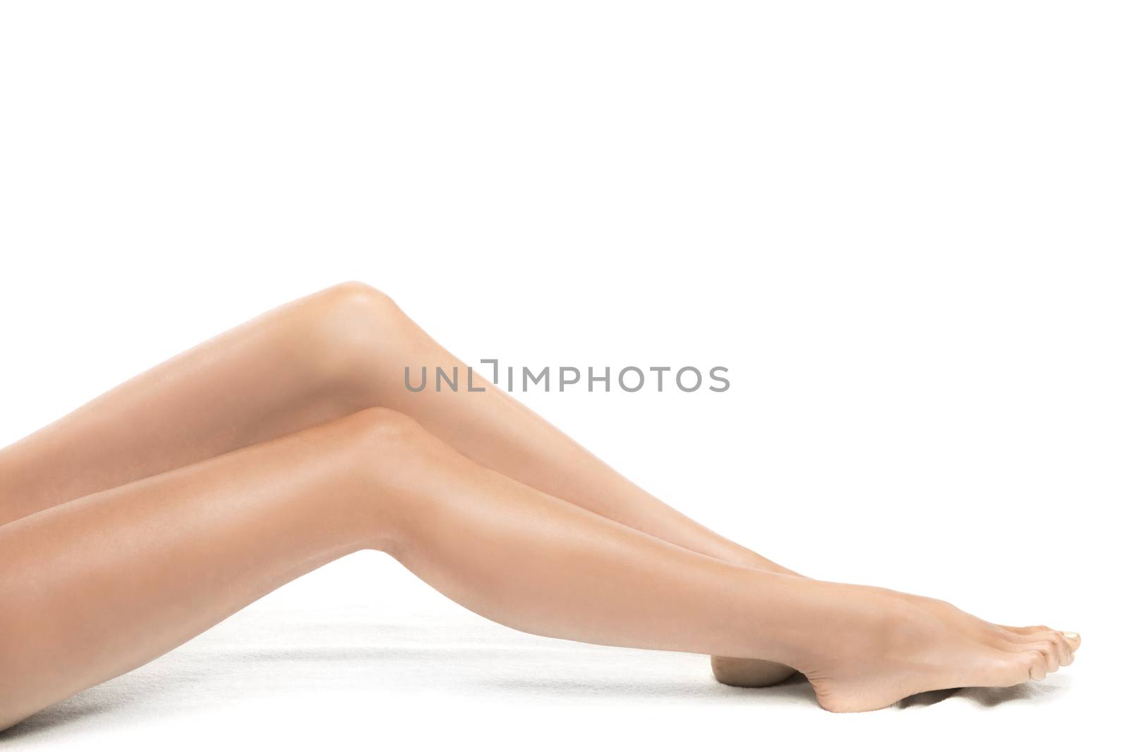 Perfect female legs isolated on white background