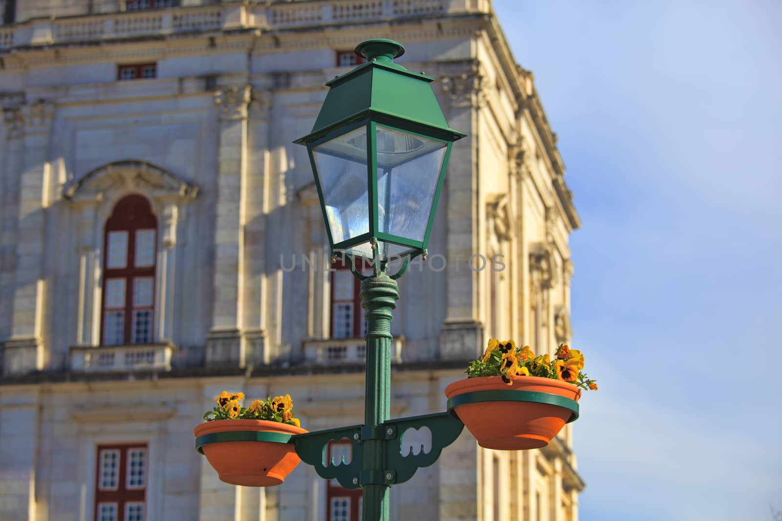Typical metal street lamp at Mafra (Portugal) by kalnenko