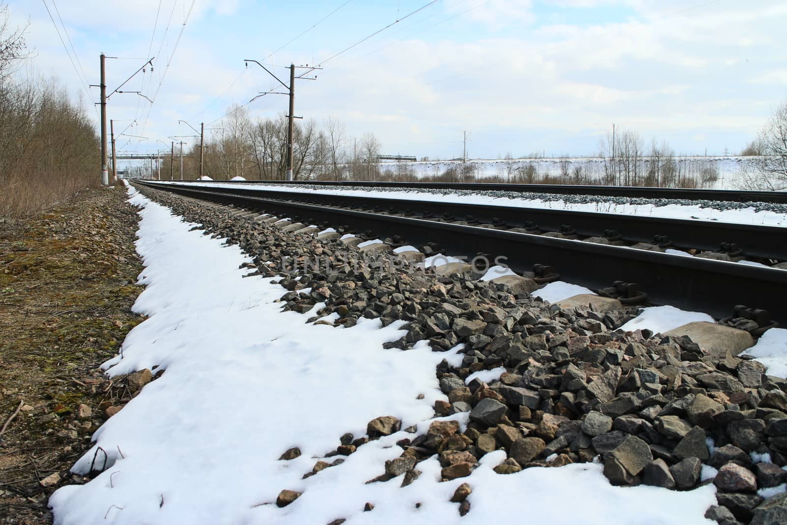 rails of railway forward go into distance at winter