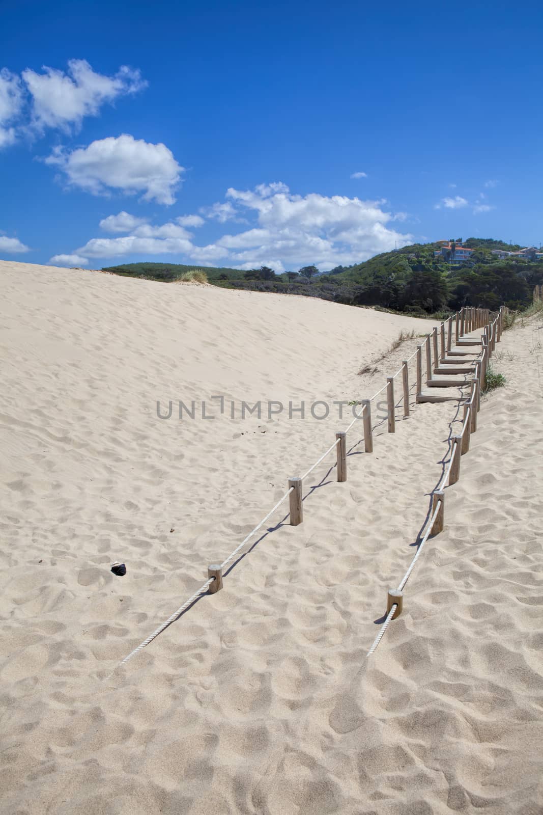 Wooden board path way to the sandy beach by kalnenko